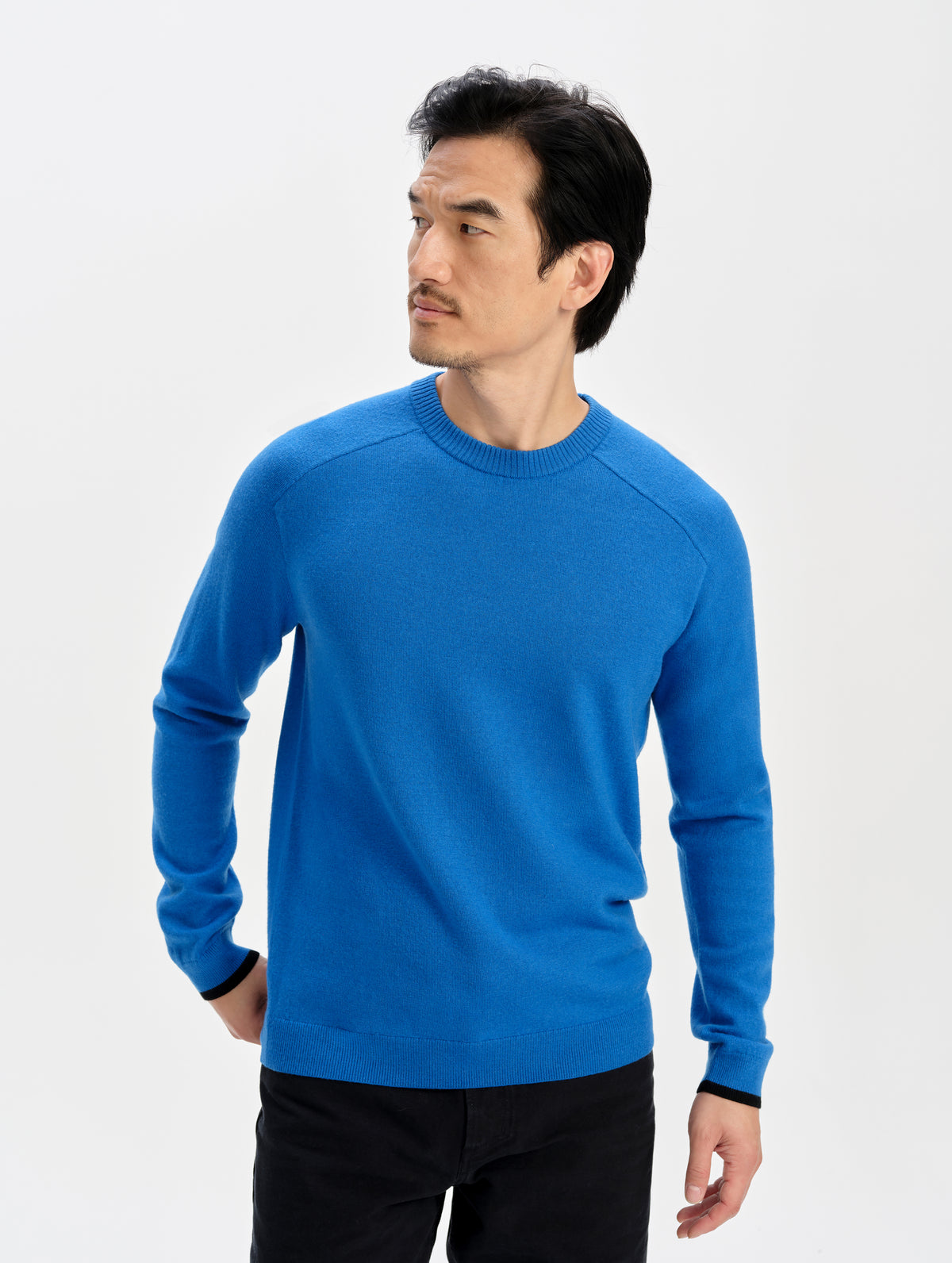 Front upper-body view of man wearing the Corbin Sweater in Summit Blue from AETHER Apparel.