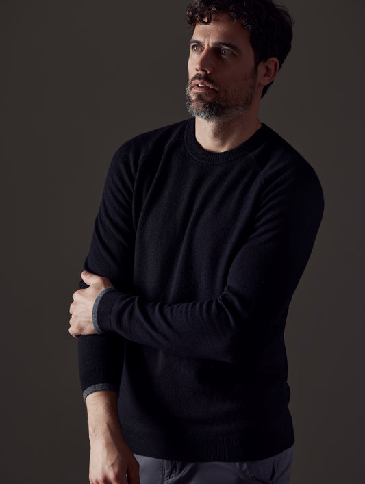 Front 3/4 body view of man wearing Corbin Sweater in Onyx Black from AETHER Apparel.