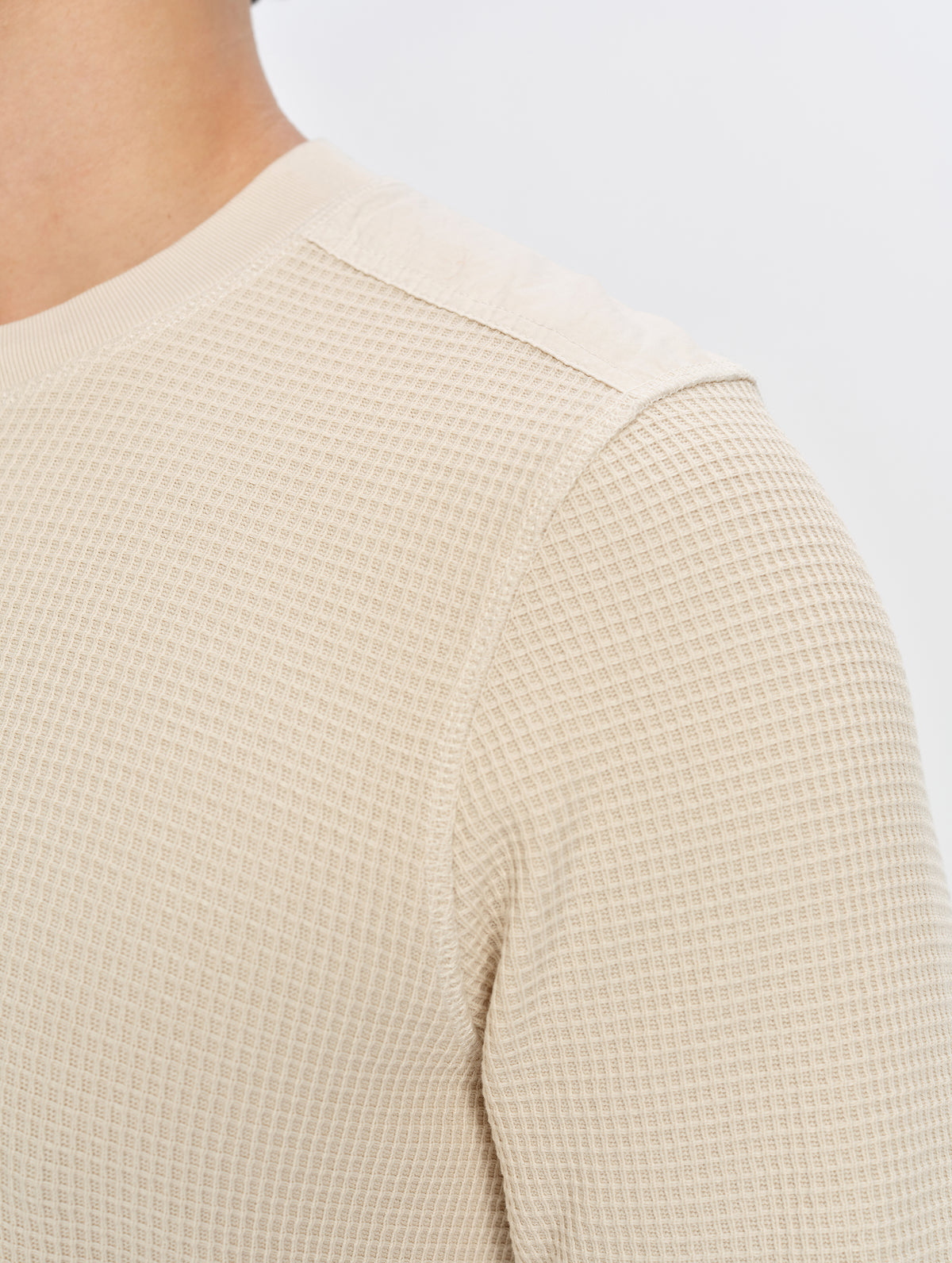 Closeup detailed view of the shoulder seams on the Daley Waffle Henley in Bone from AETHER Apparel.