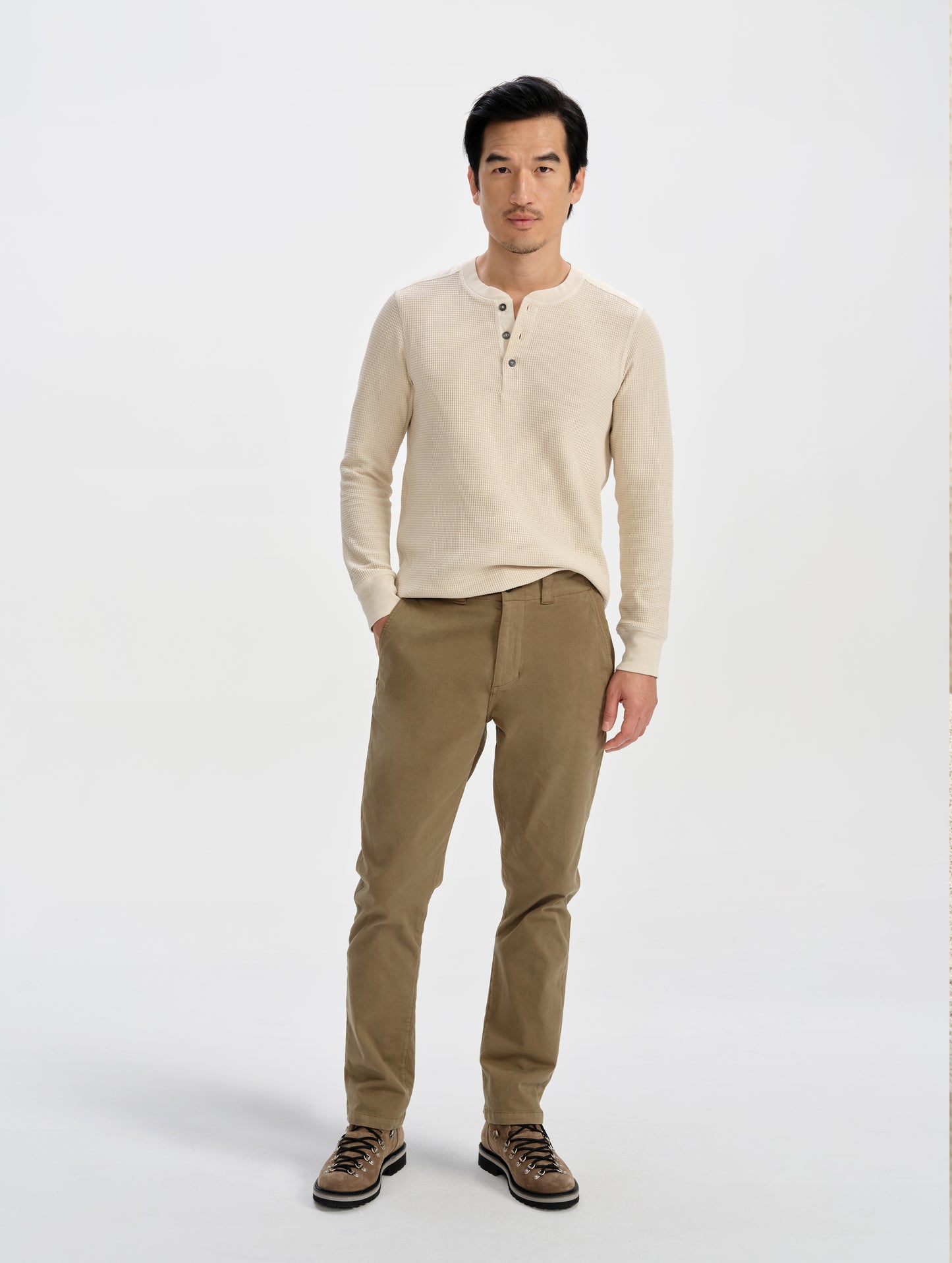 Front full-body view of man wearing the Daley Waffle Henley in Bone from AETHER Apparel.
