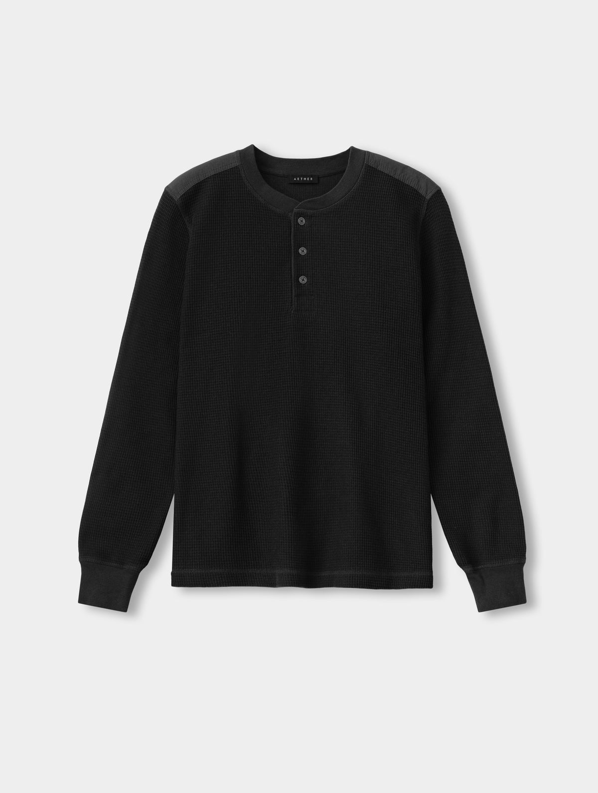 Flat lay view of the Daley Waffle Henley in Onyx Black from AETHER Apparel.