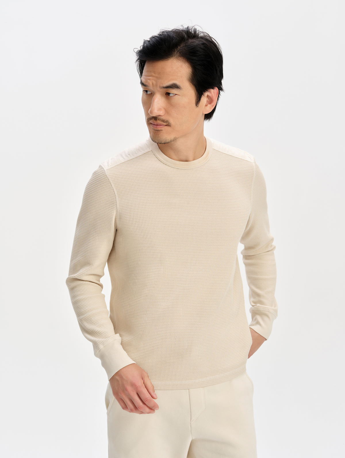 Front upper-body view of man wearing the Daley Waffle Shirt in Bone from AETHER Apparel.
