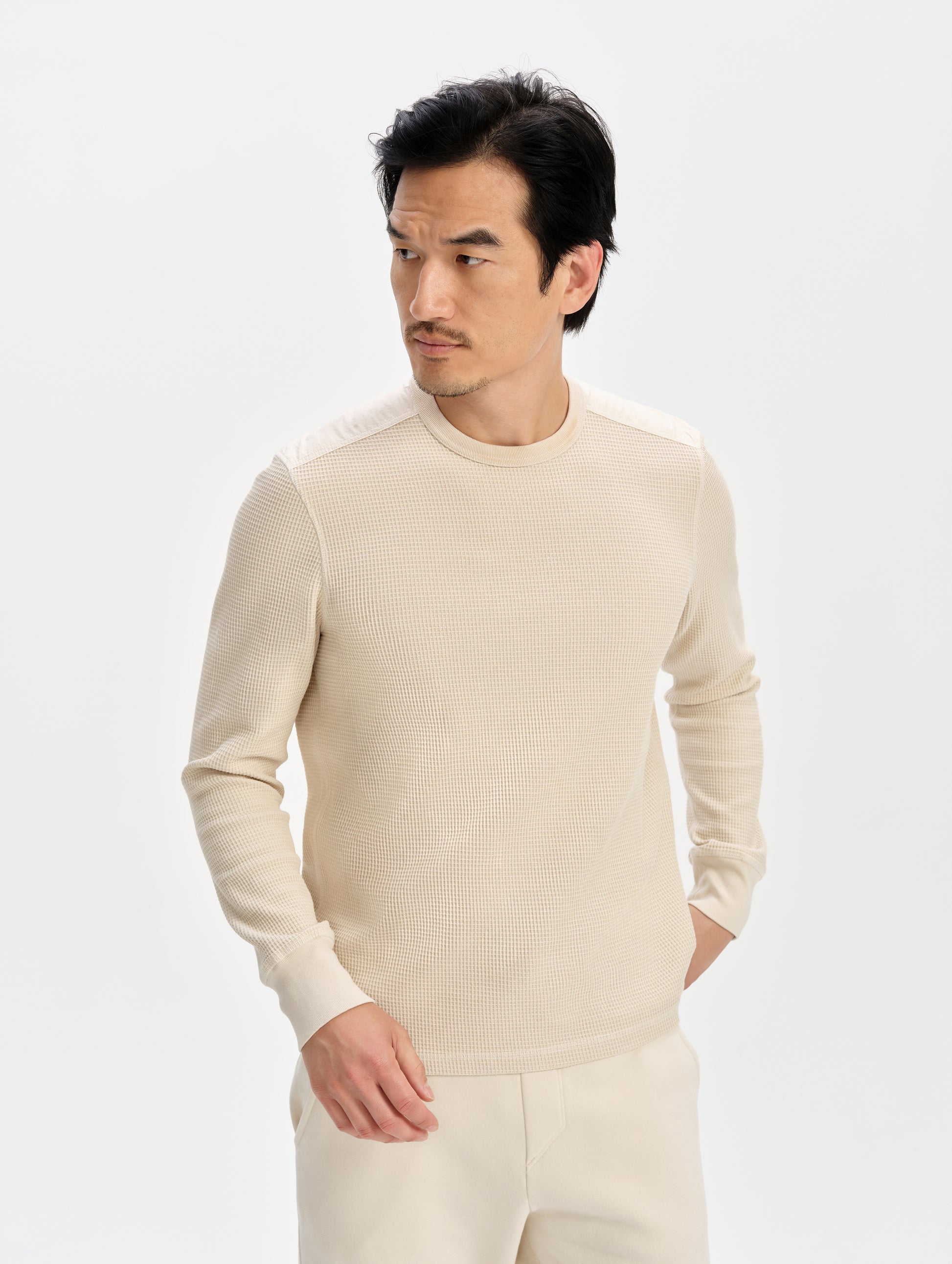Front upper-body view of man wearing the Daley Waffle Shirt in Bone from AETHER Apparel.