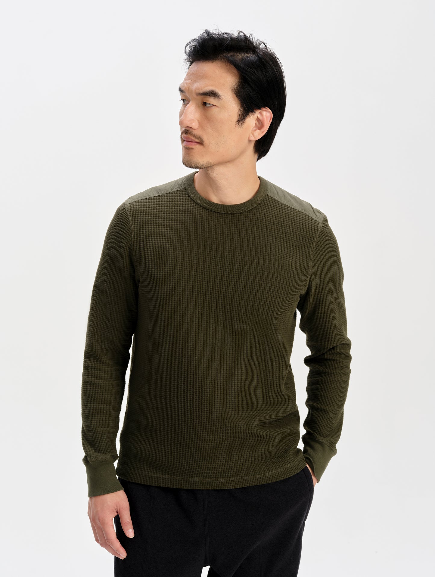 Front upper-body view of man wearing the Daley Waffle Shirt in Forest Green from AETHER Apparel.