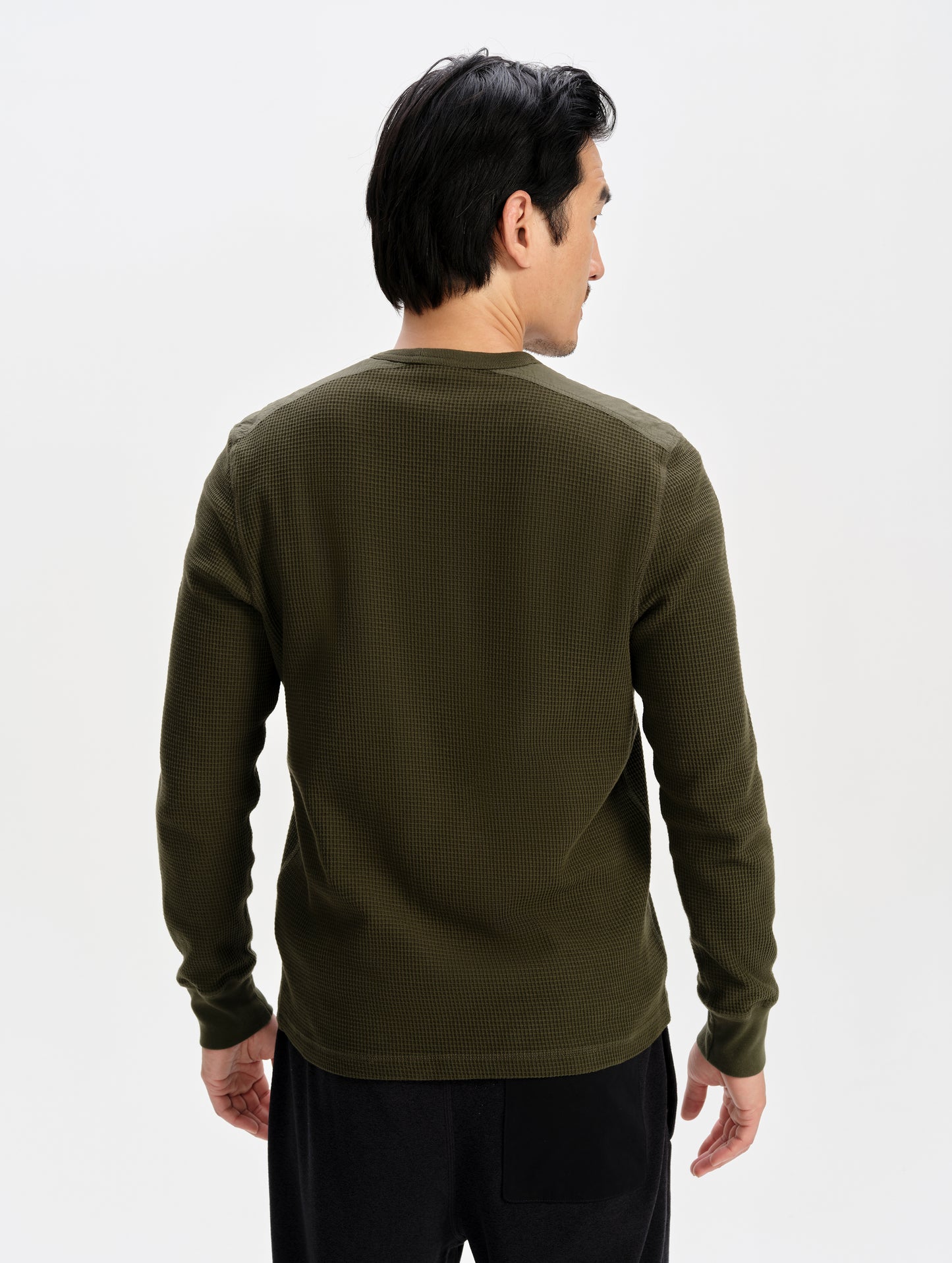 Rear upper-body view of man wearing the Daley Waffle Shirt in Forest Green from AETHER Apparel.
