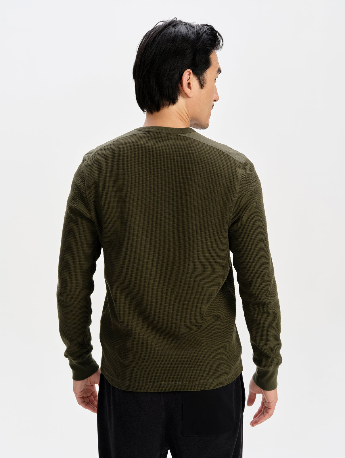 Rear upper-body view of man wearing the Daley Waffle Shirt in Forest Green from AETHER Apparel.