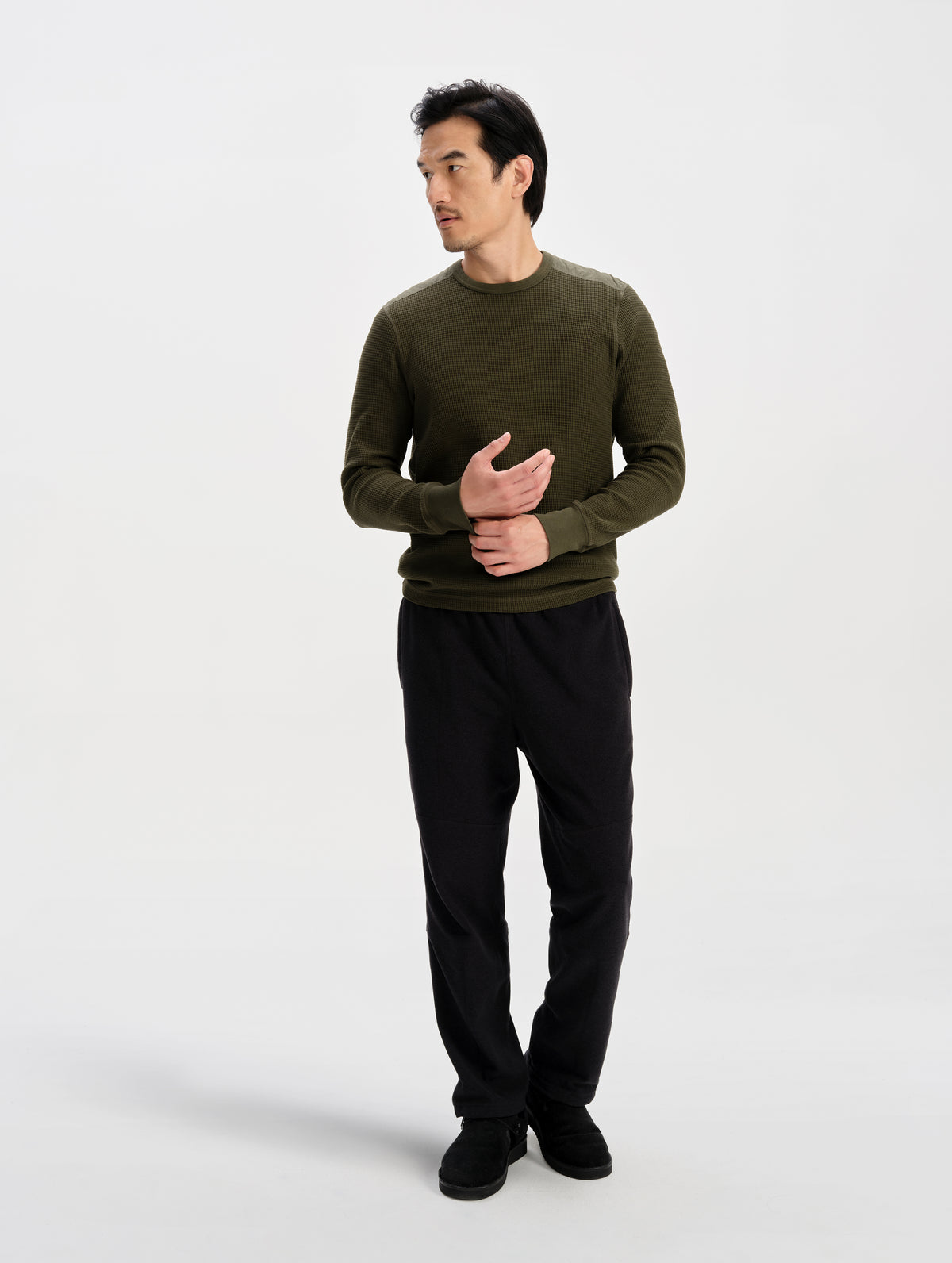 Front full-body view of man wearing the Daley Waffle Shirt in Forest Green from AETHER Apparel.