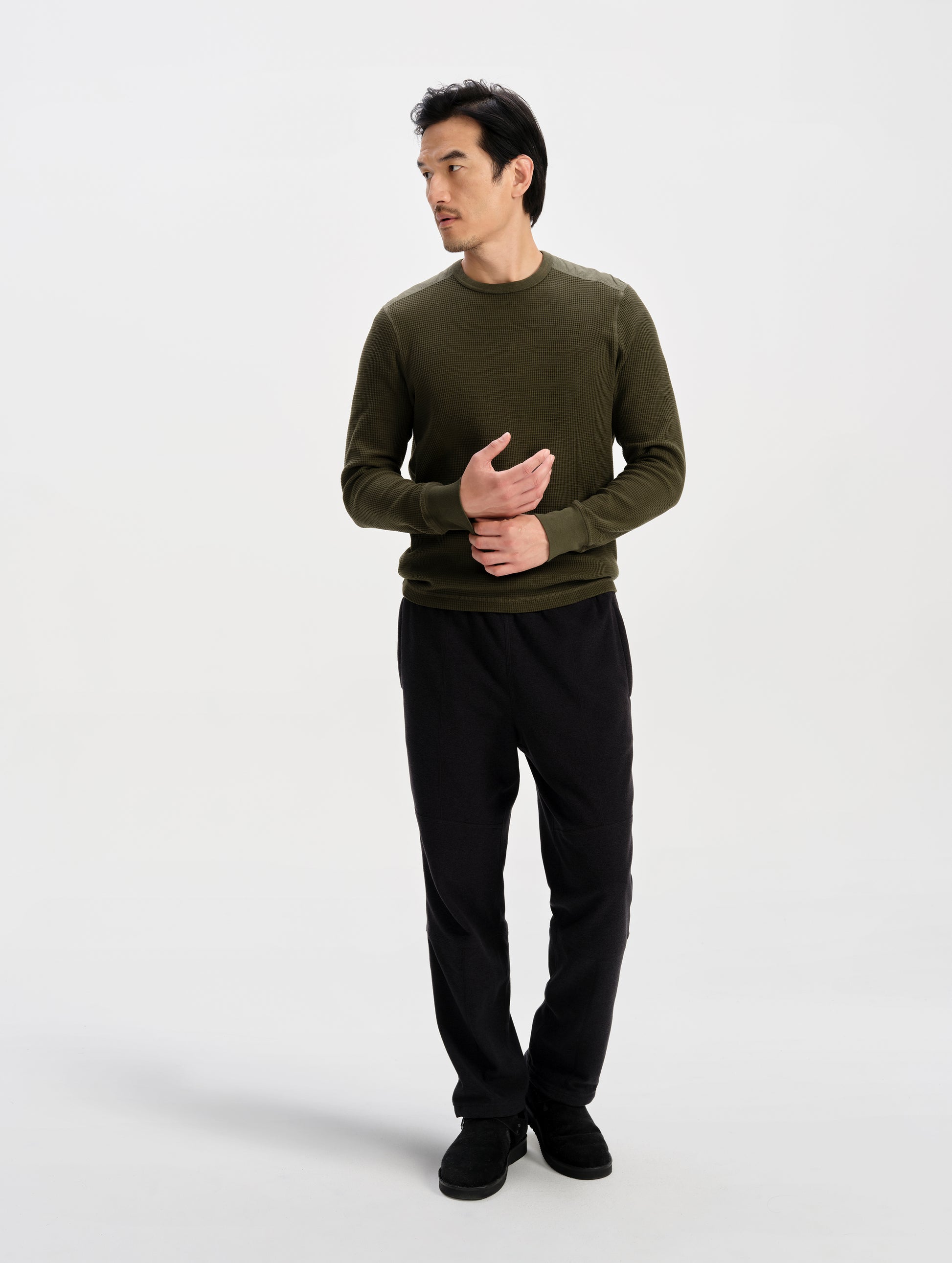 Front full-body view of man wearing the Daley Waffle Shirt in Forest Green from AETHER Apparel.