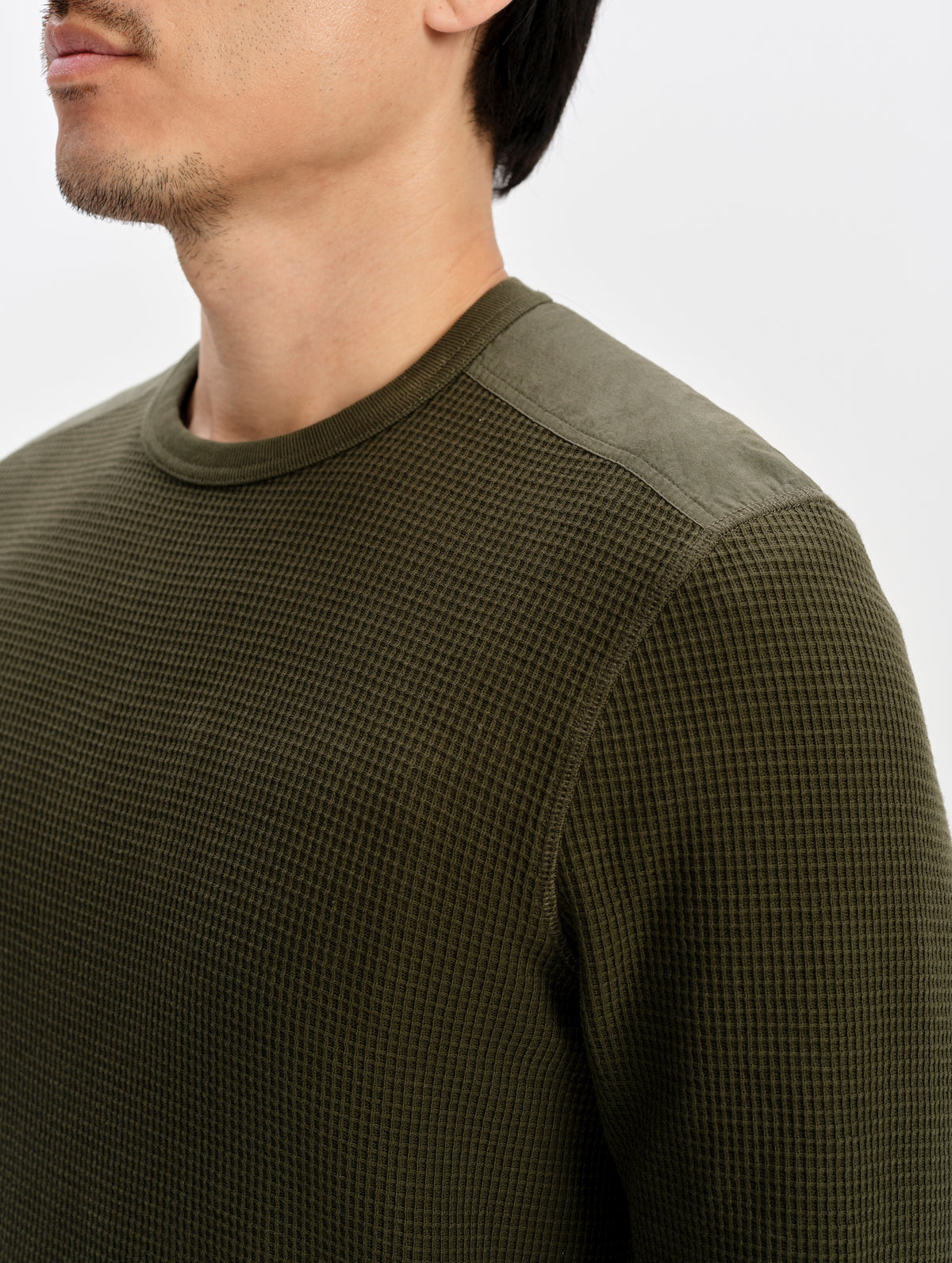 Closeup detailed view of the contrast shoulder panels on the Daley Waffle Shirt in Forest Green from AETHER Apparel.