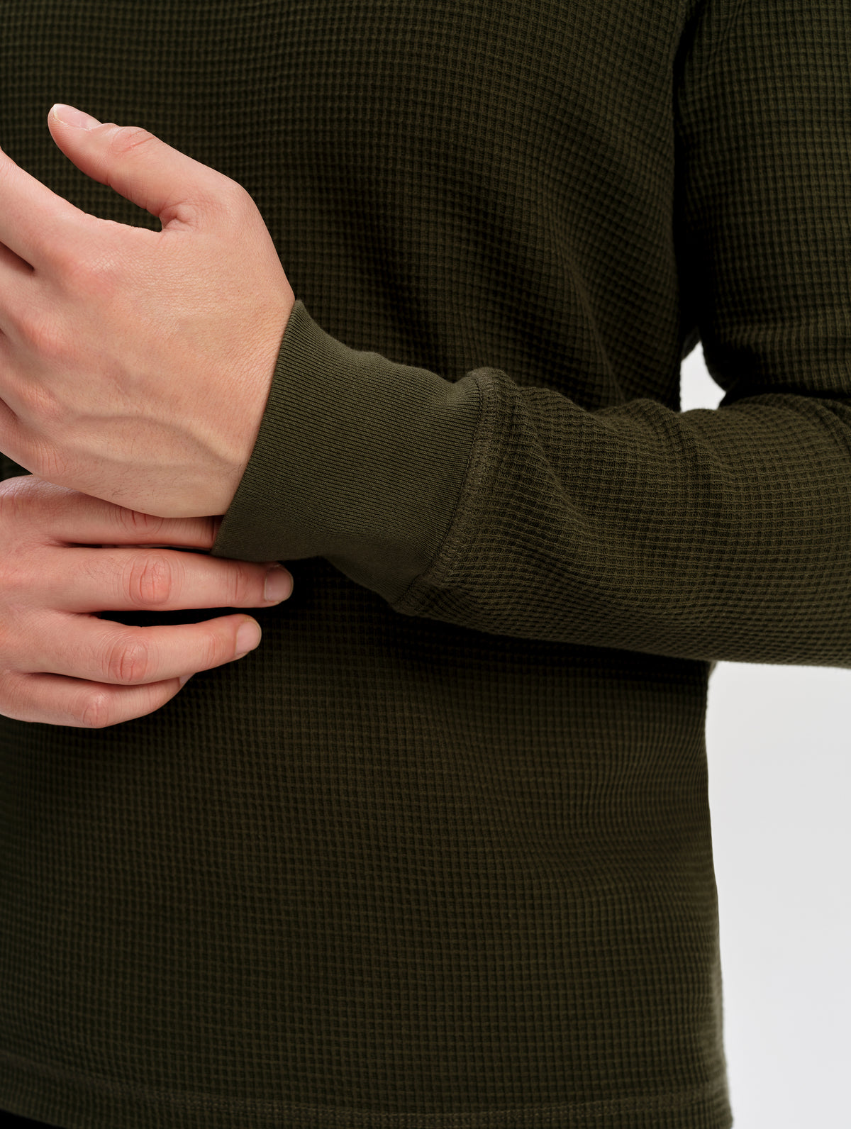 Closeup detailed view of the cuffs on the Daley Waffle Shirt in Forest Green from AETHER Apparel.
