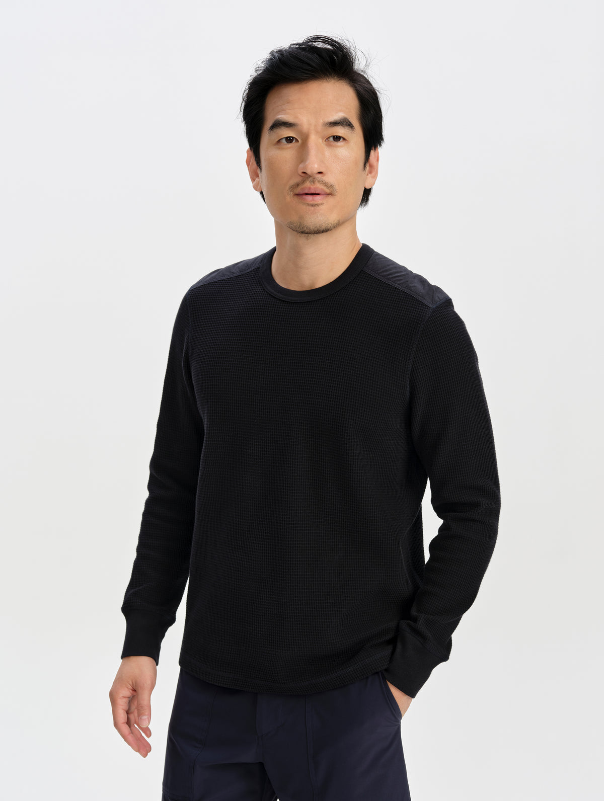 Front upper-body view of man wearing the Daley Waffle Shirt in Onyx Black from AETHER Apparel.