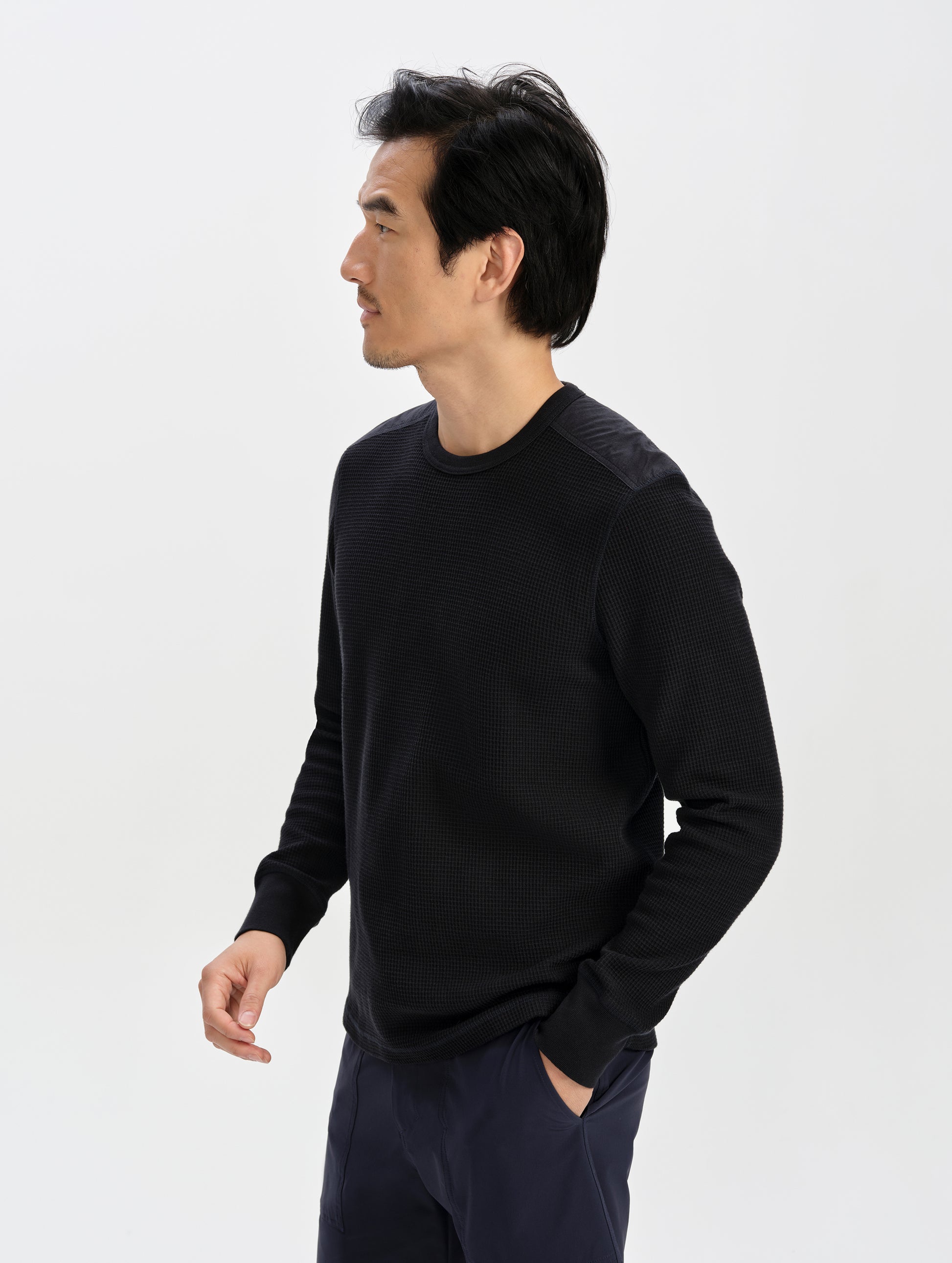 Front 3/4 upper-body view of man wearing the Daley Waffle Shirt in Onyx Black from AETHER Apparel.