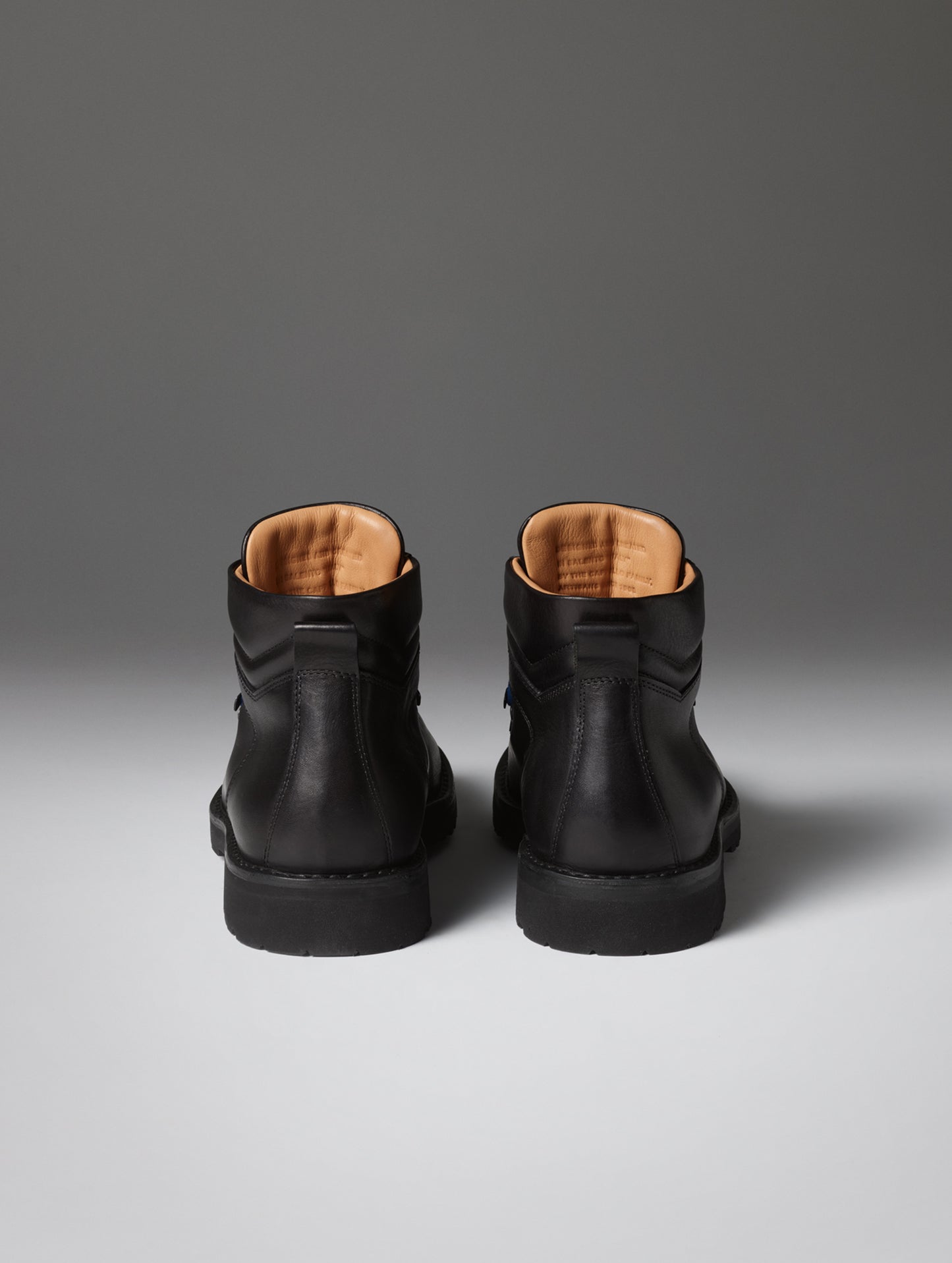 Rear view of the men's Dolomite Boot in Onyx Black from AETHER Apparel.
