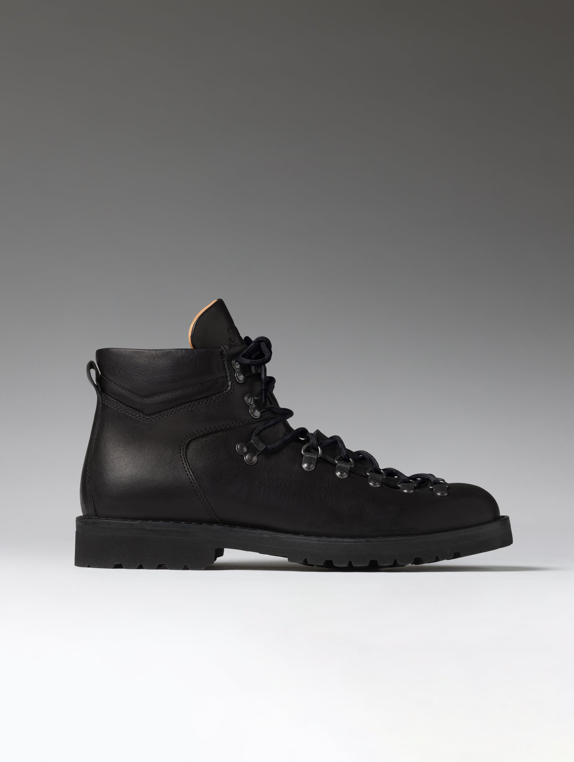 Side profile view of the men's Dolomite Boot in Onyx Black from AETHER Apparel.