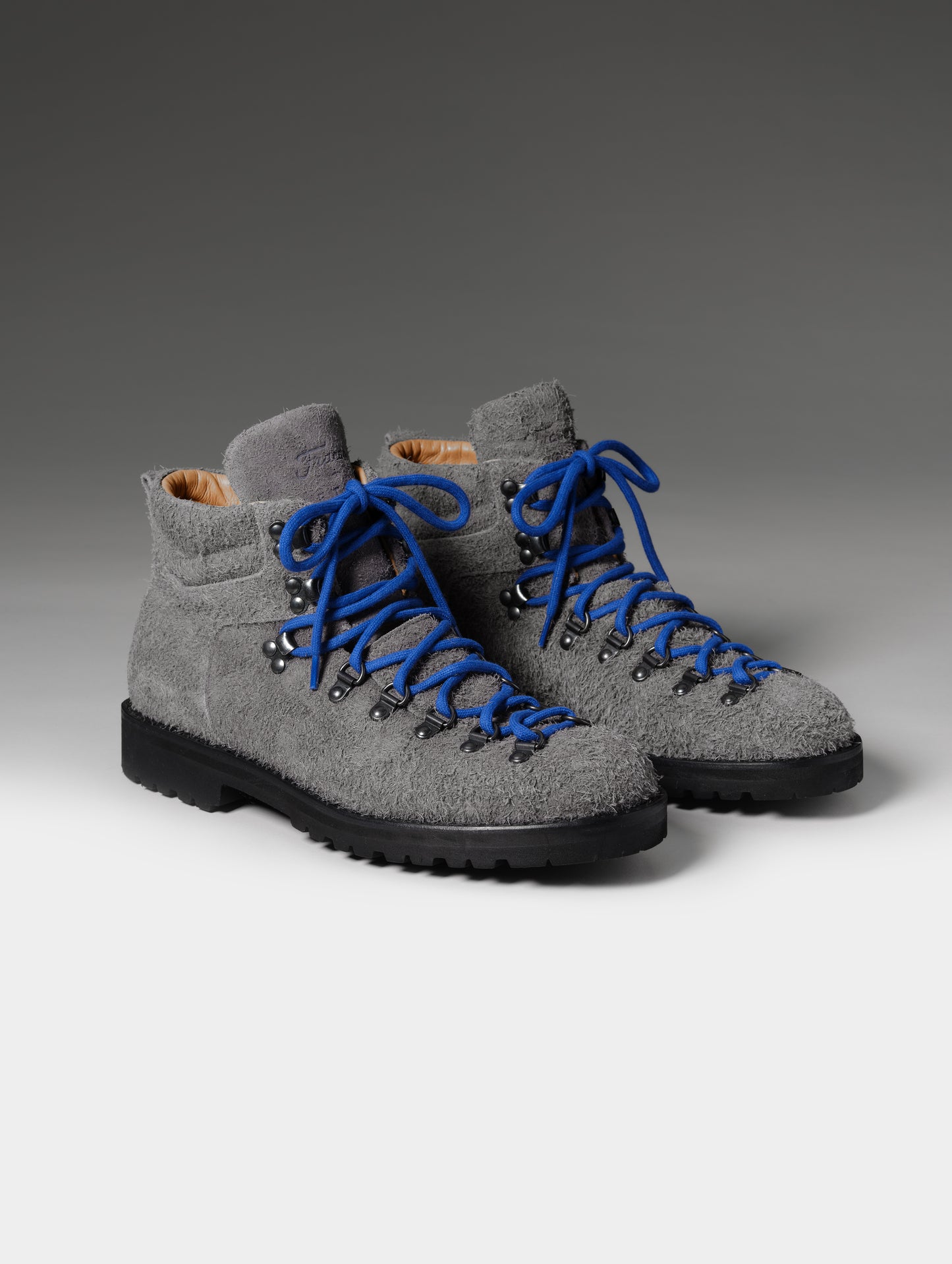 Front 3/4 studio shot of the Dolomite Boot in Cement with blue laces from AETHER Apparel.