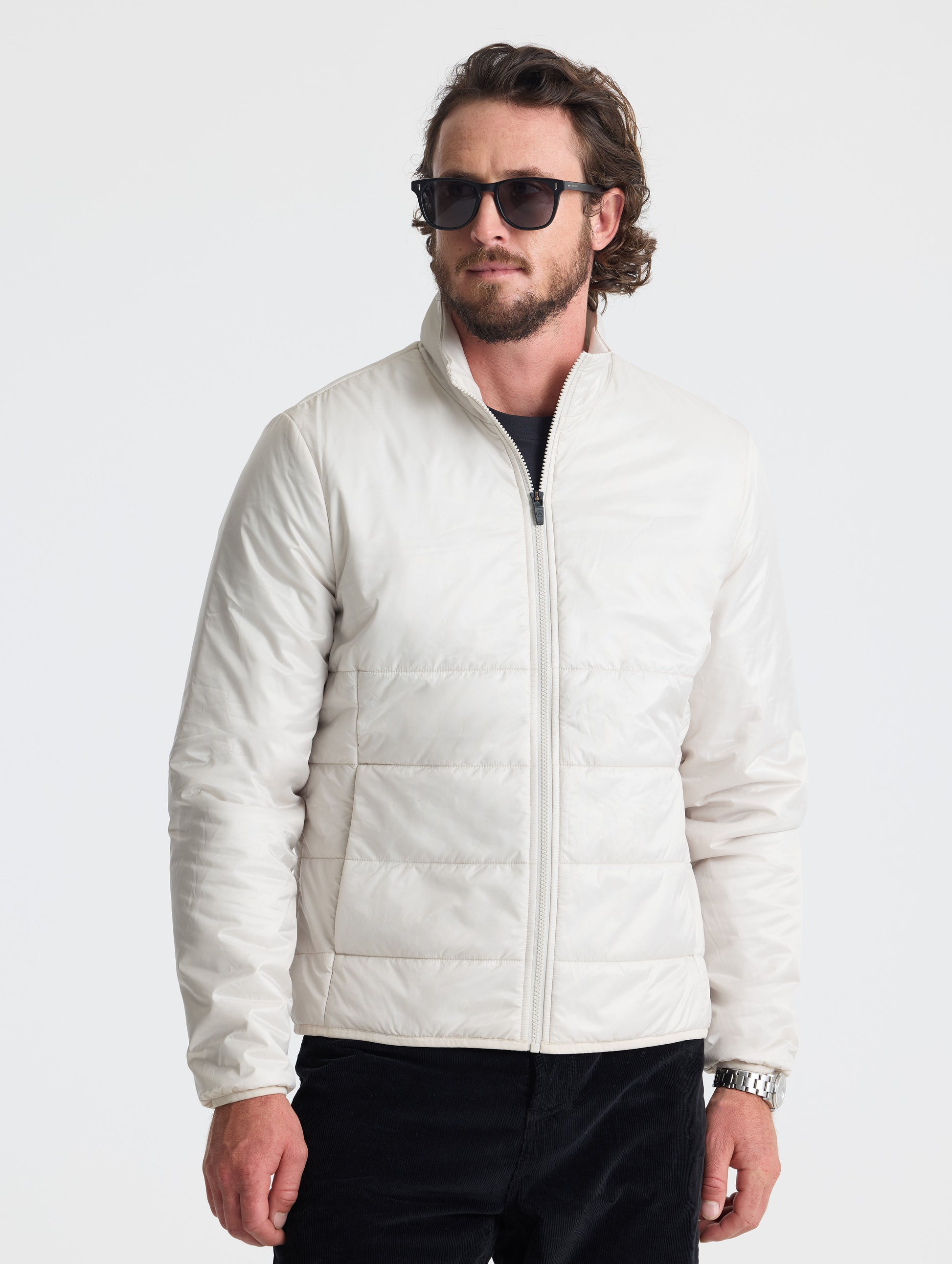 Front view of man wearing Eco Insulated Jacket in Bone white from AETHER Apparel.