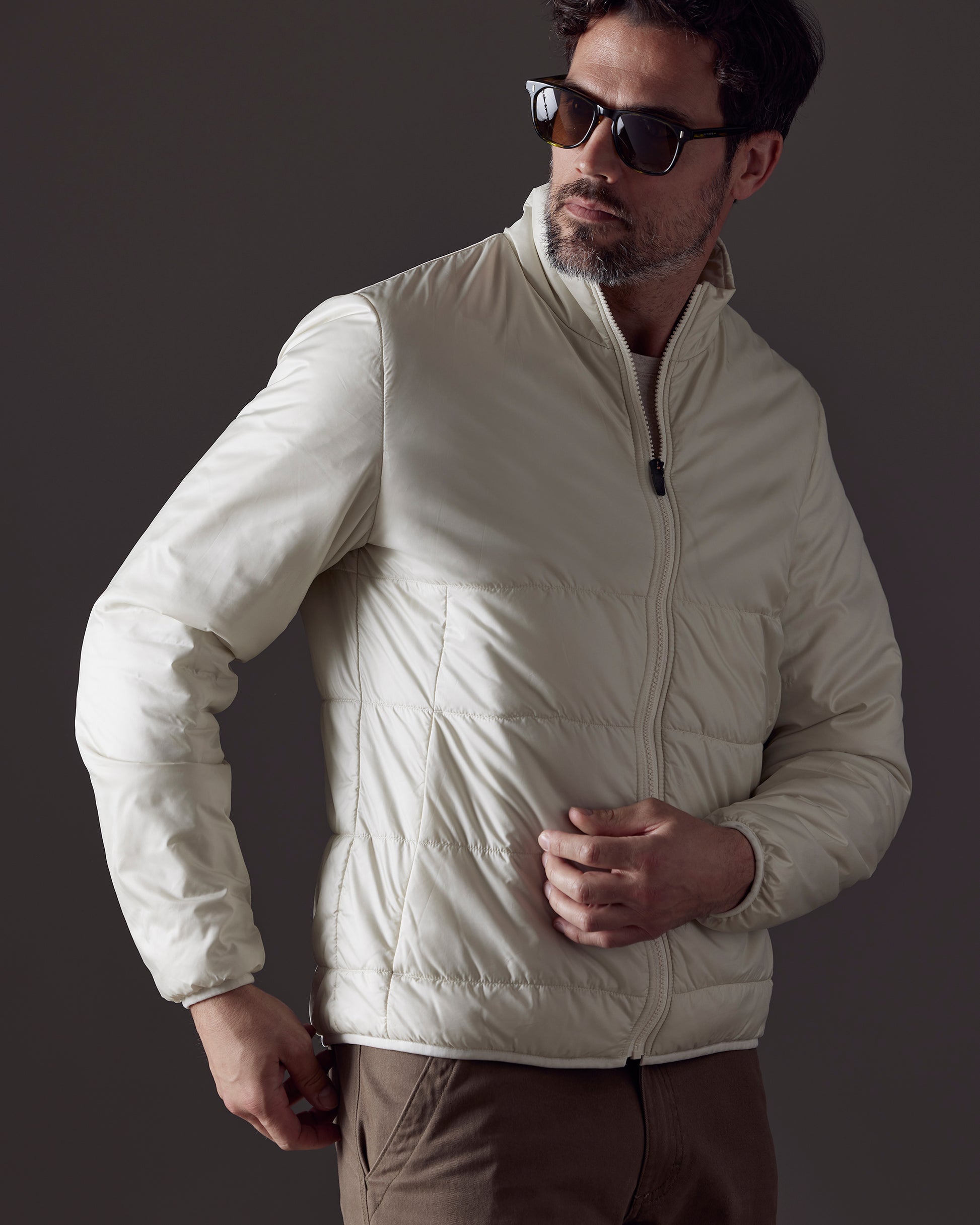 Man wearing white Eco Insulated Jacket from AETHER Apparel
