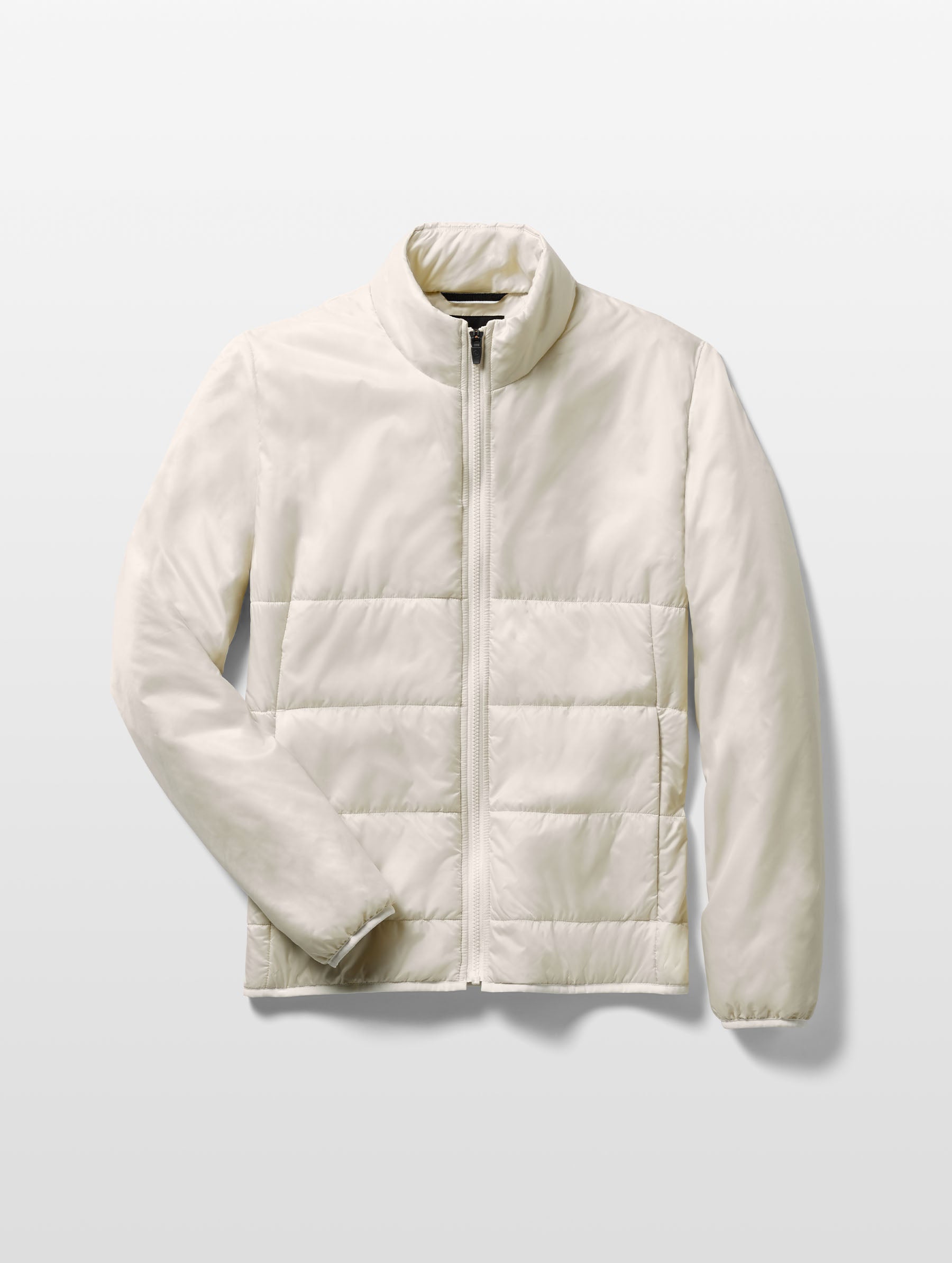 Flat lay of Eco Insulated Jacket in Bone white from AETHER Apparel.