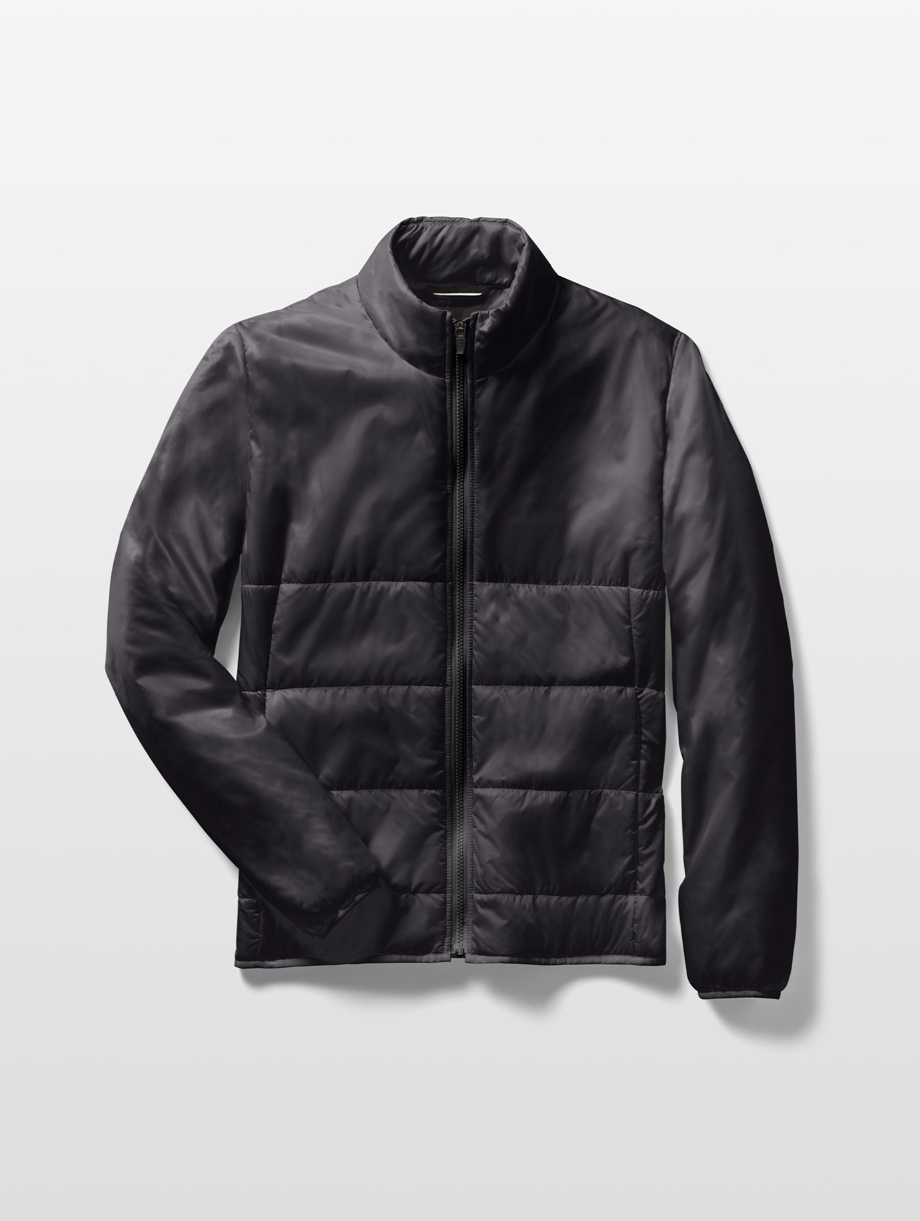 Flat lay of Eco Insulated Jacket in Onyx Black from AETHER Apparel.