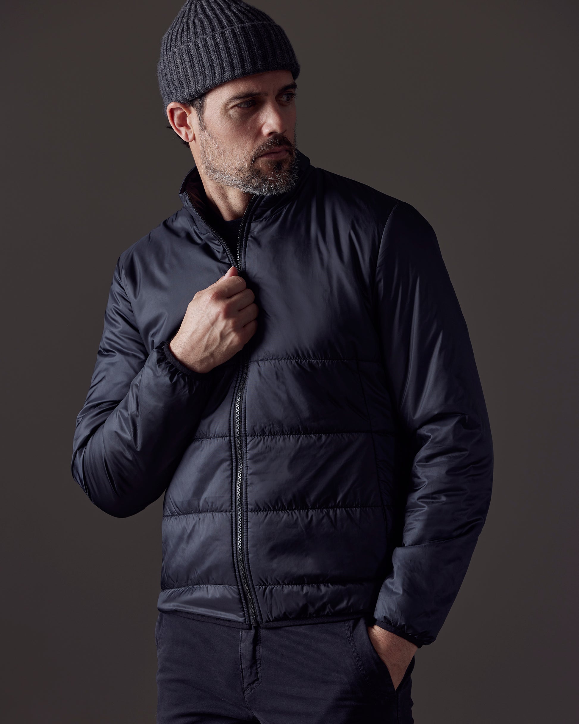 Man wearing black Eco Insulated Jacket from AETHER Apparel