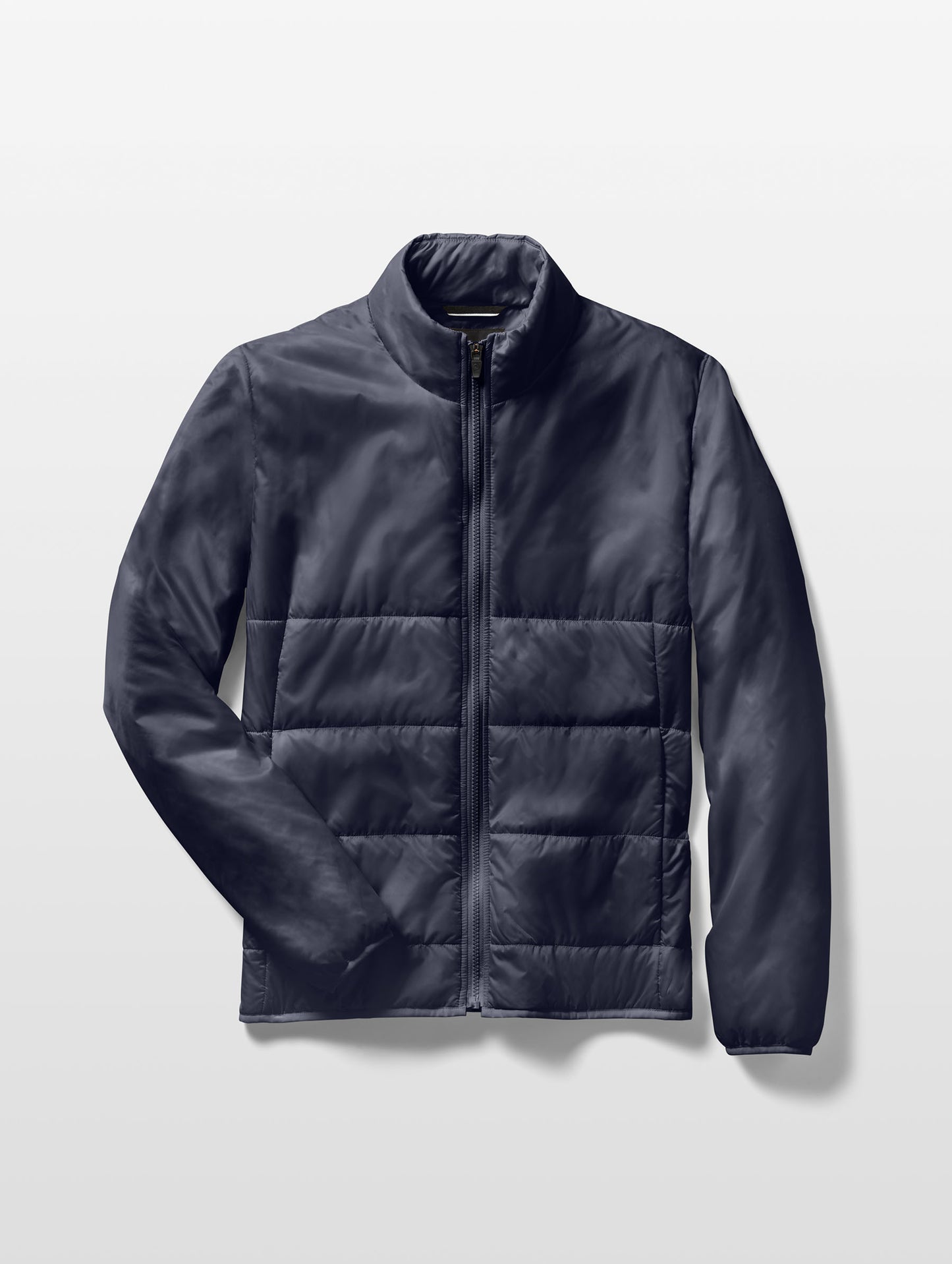 Flat lay image of Eco Insulated Jacket in Total Eclipse dark blue from AETHER Apparel.