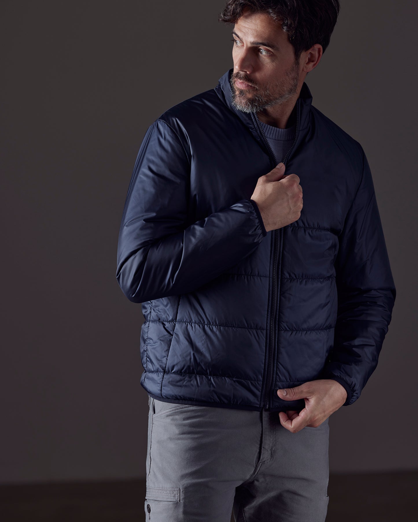 Man wearing blue Eco Insulated Jacket from AETHER Apparel