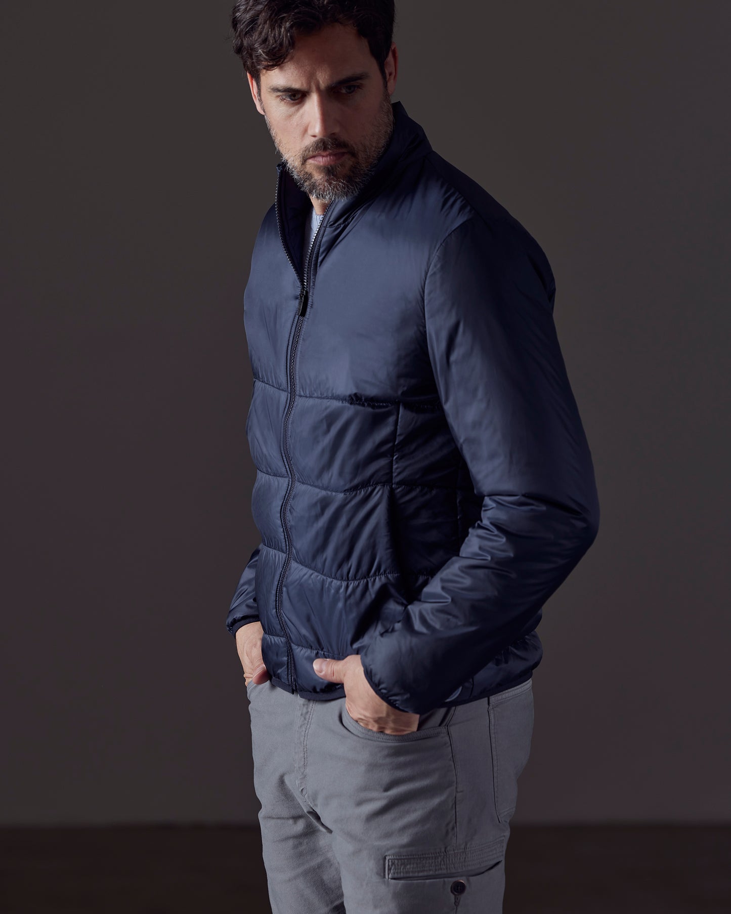 Man wearing blue Eco Insulated Jacket from AETHER Apparel
