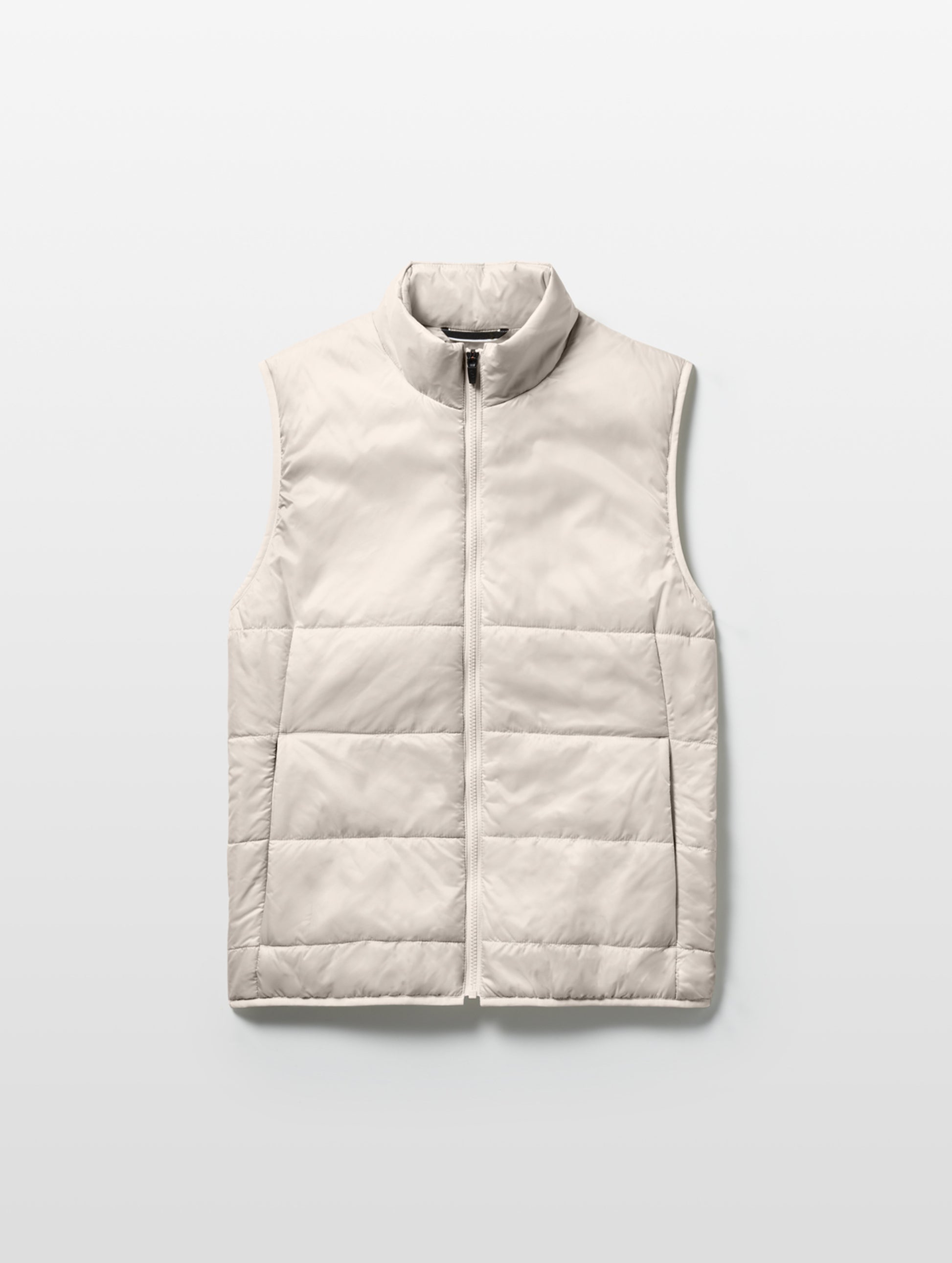 Flat lay of Eco Insulated Vest in Bone white from AETHER Apparel.