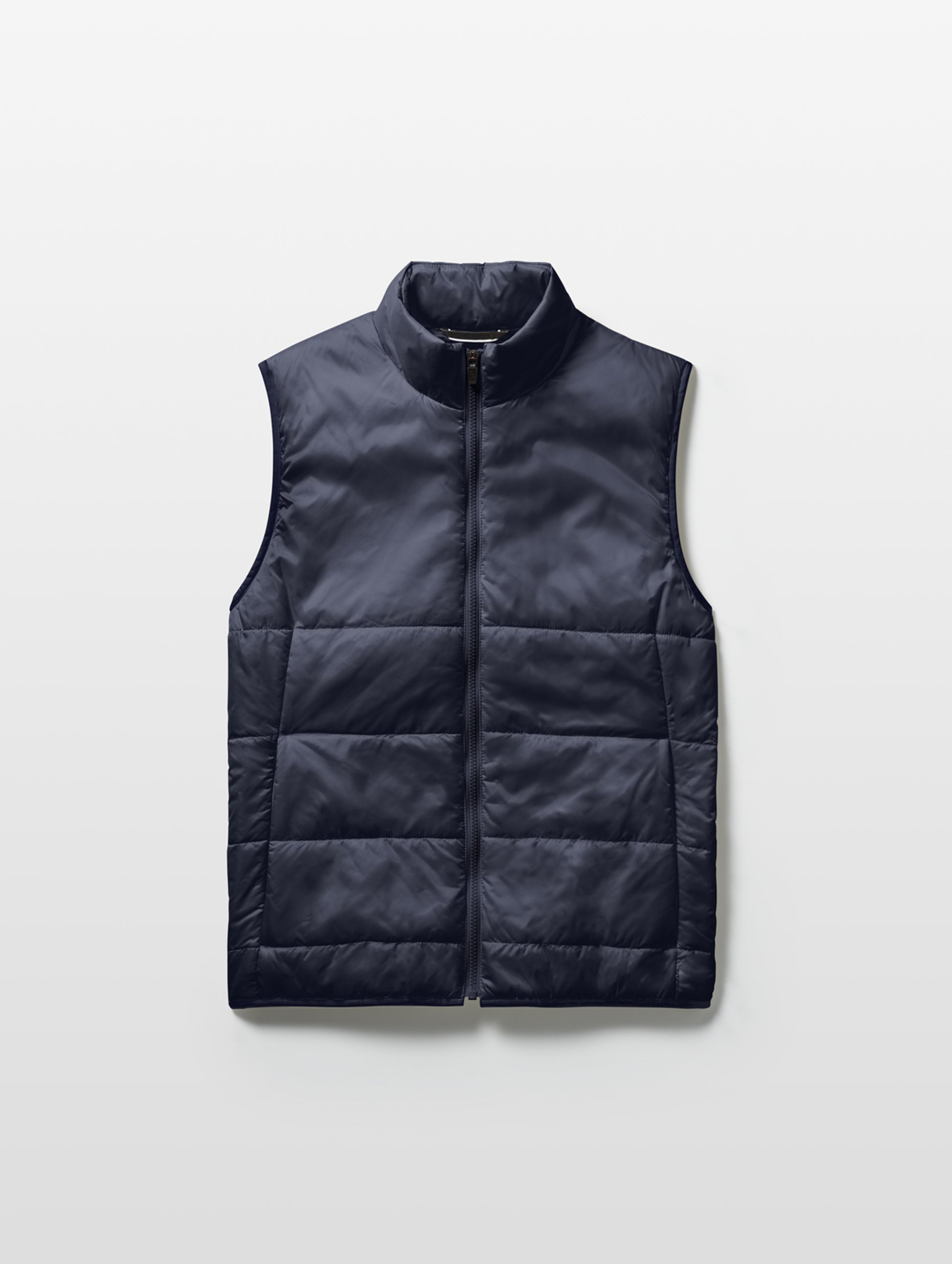 Flat lay of Eco Insulated Vest in Total Eclipse dark blue from AETHER Apparel.