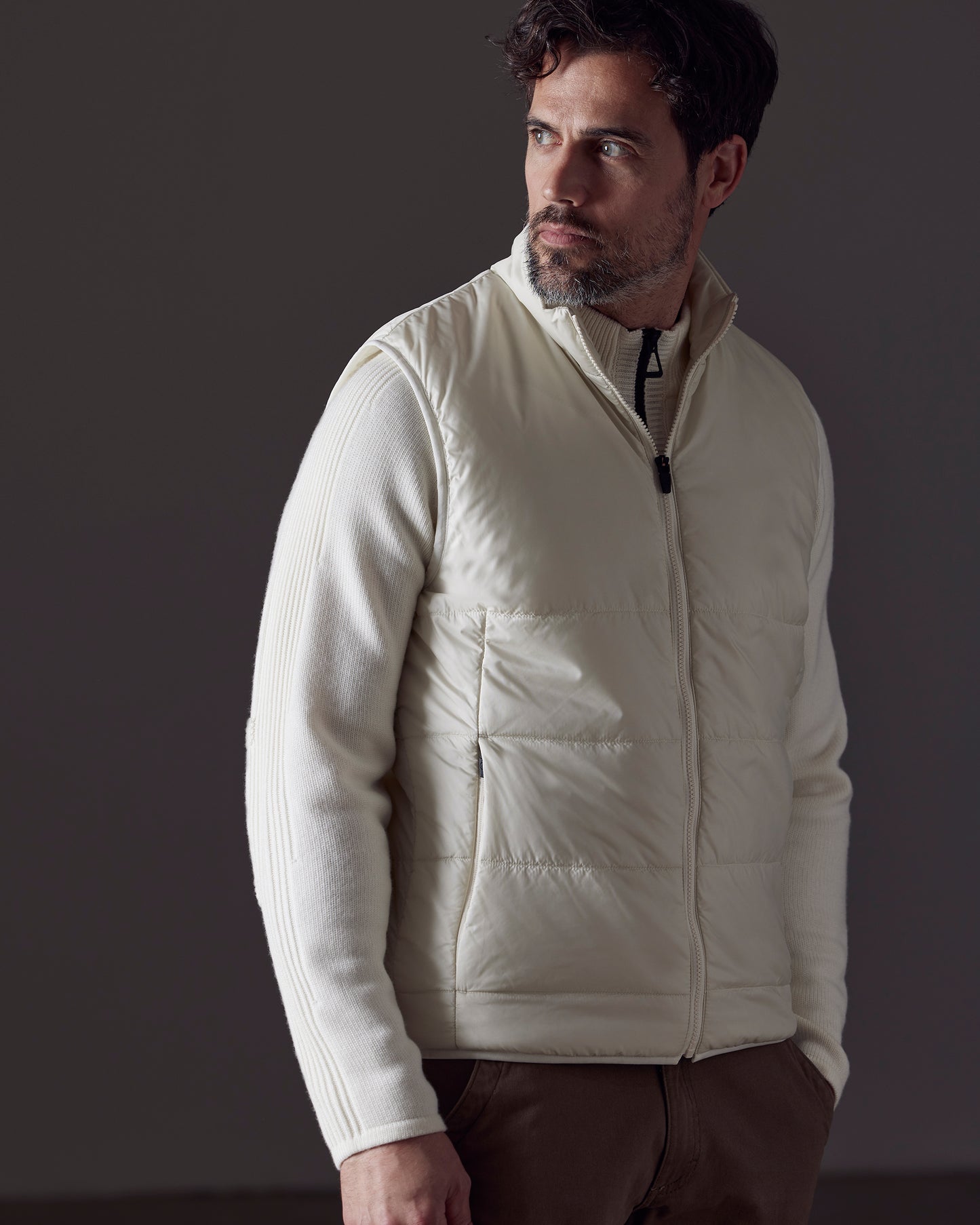 Man wearing white Eco Insulated Vest from AETHER Apparel