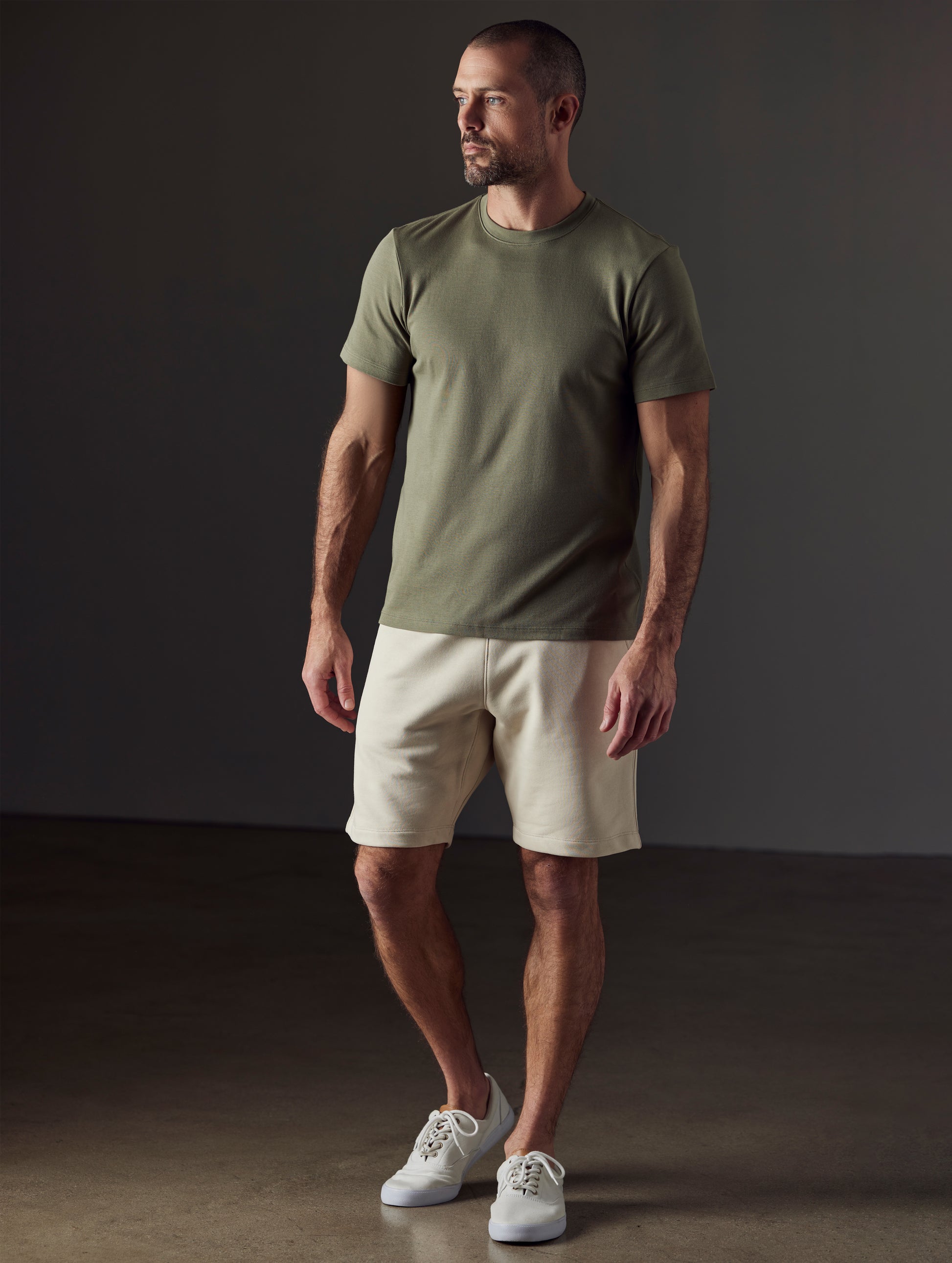 Man wearing green organic cotton tee from AETHER Apparel