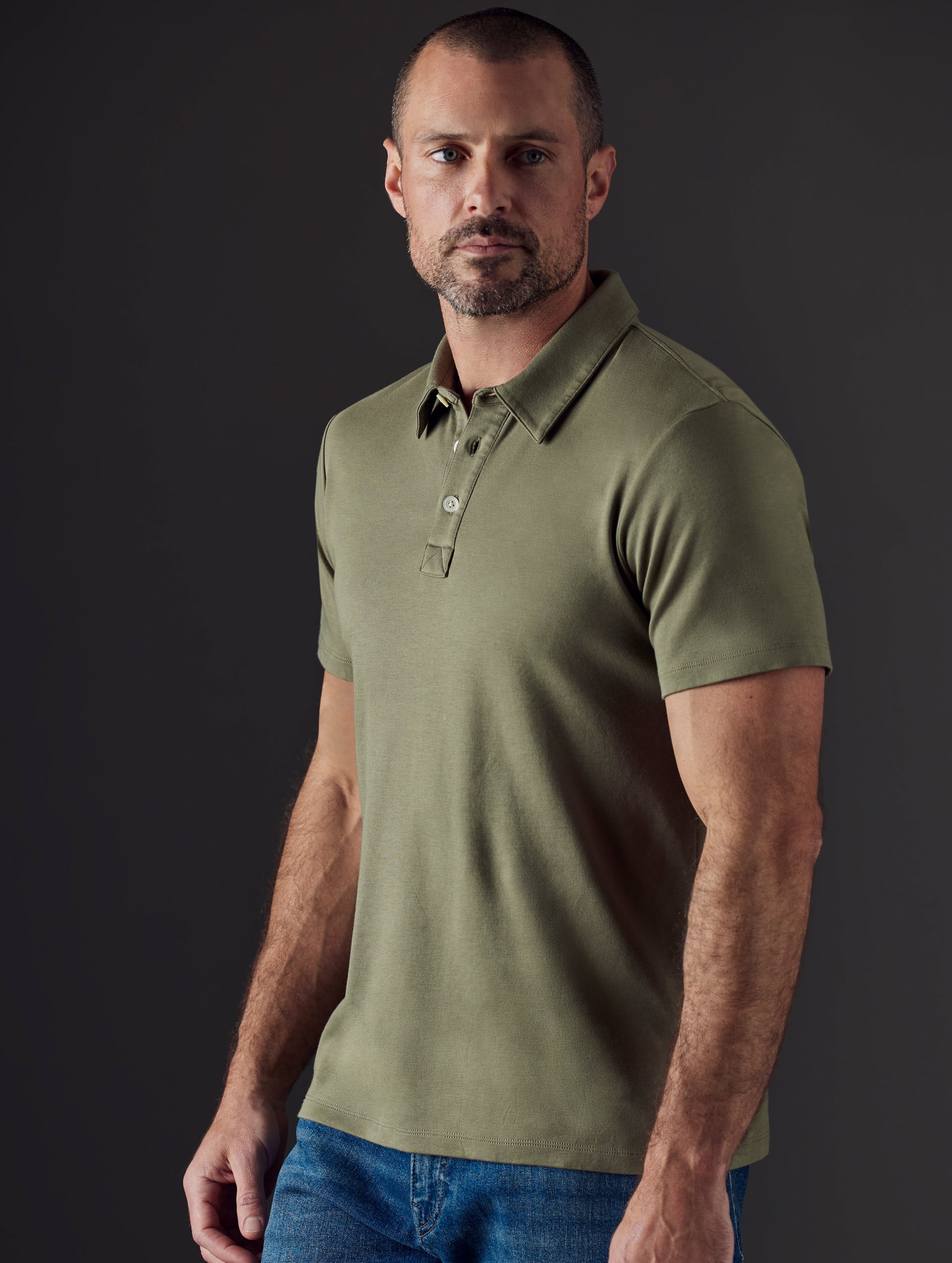 Man wearing green organic cotton polo from AETHER Apparel
