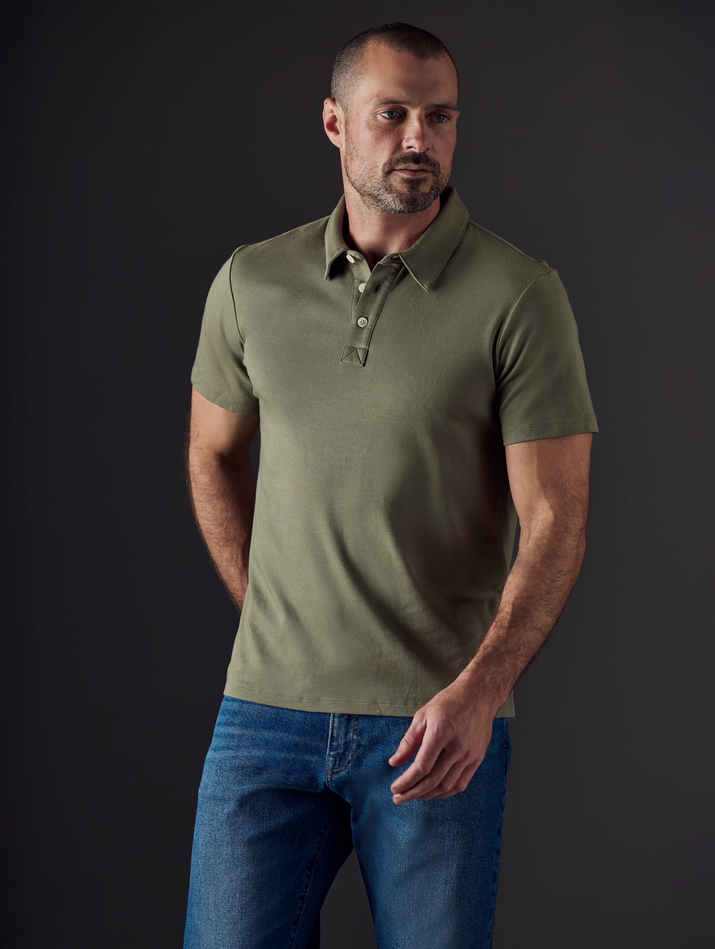 Man wearing green organic cotton polo from AETHER Apparel