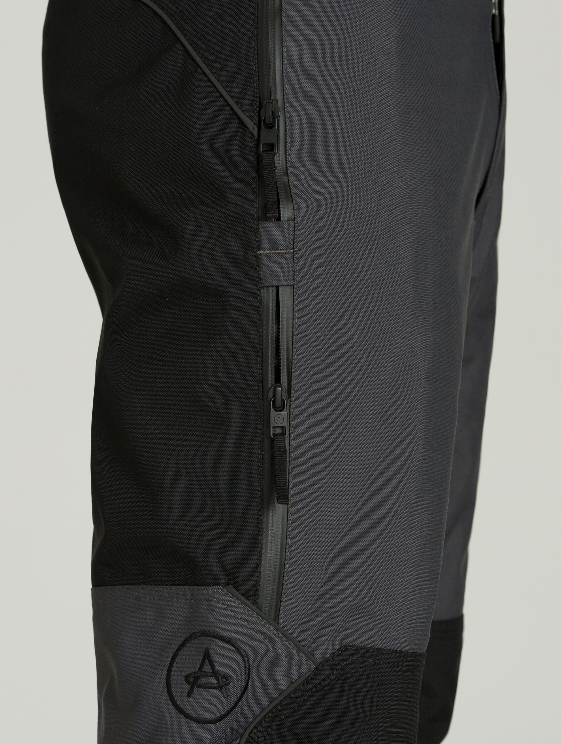 Dark grey Expedition Motorcycle Pant from AETHER Apparel, with close view of right side pocket.