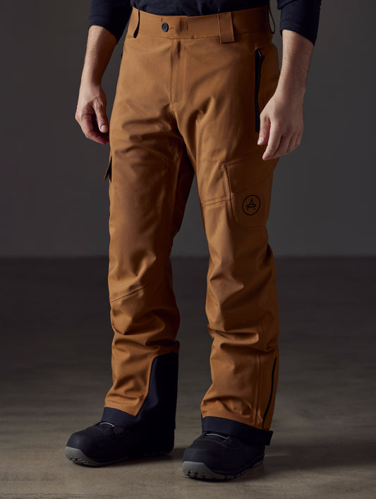 man wearing brown snow pants from AETHER Apparel