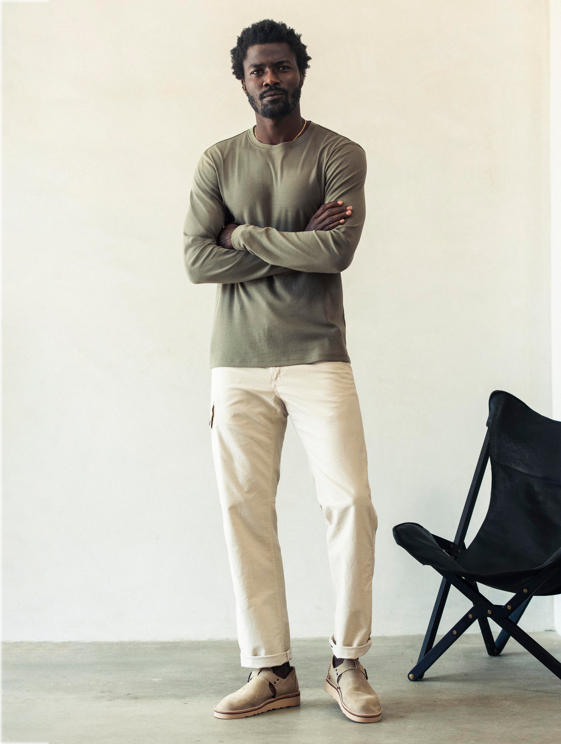 Front full body view of man wearing Fairfax Pant 2.0 in Bone white from AETHER Apparel.