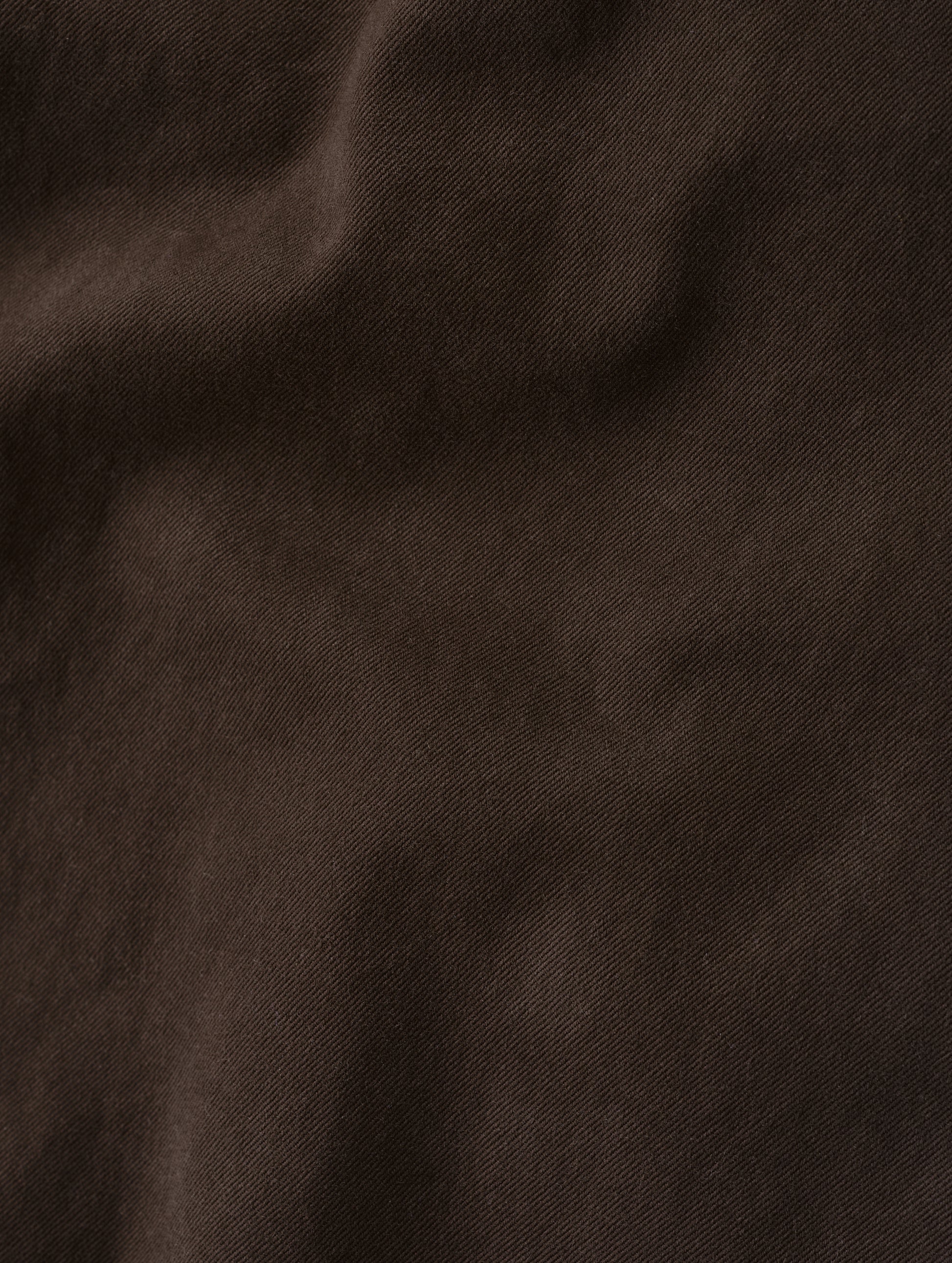 Closeup detailed view of the brushed fine twill construction on the Flint Chino Pant in Ash Brown from AETHER Apparel.