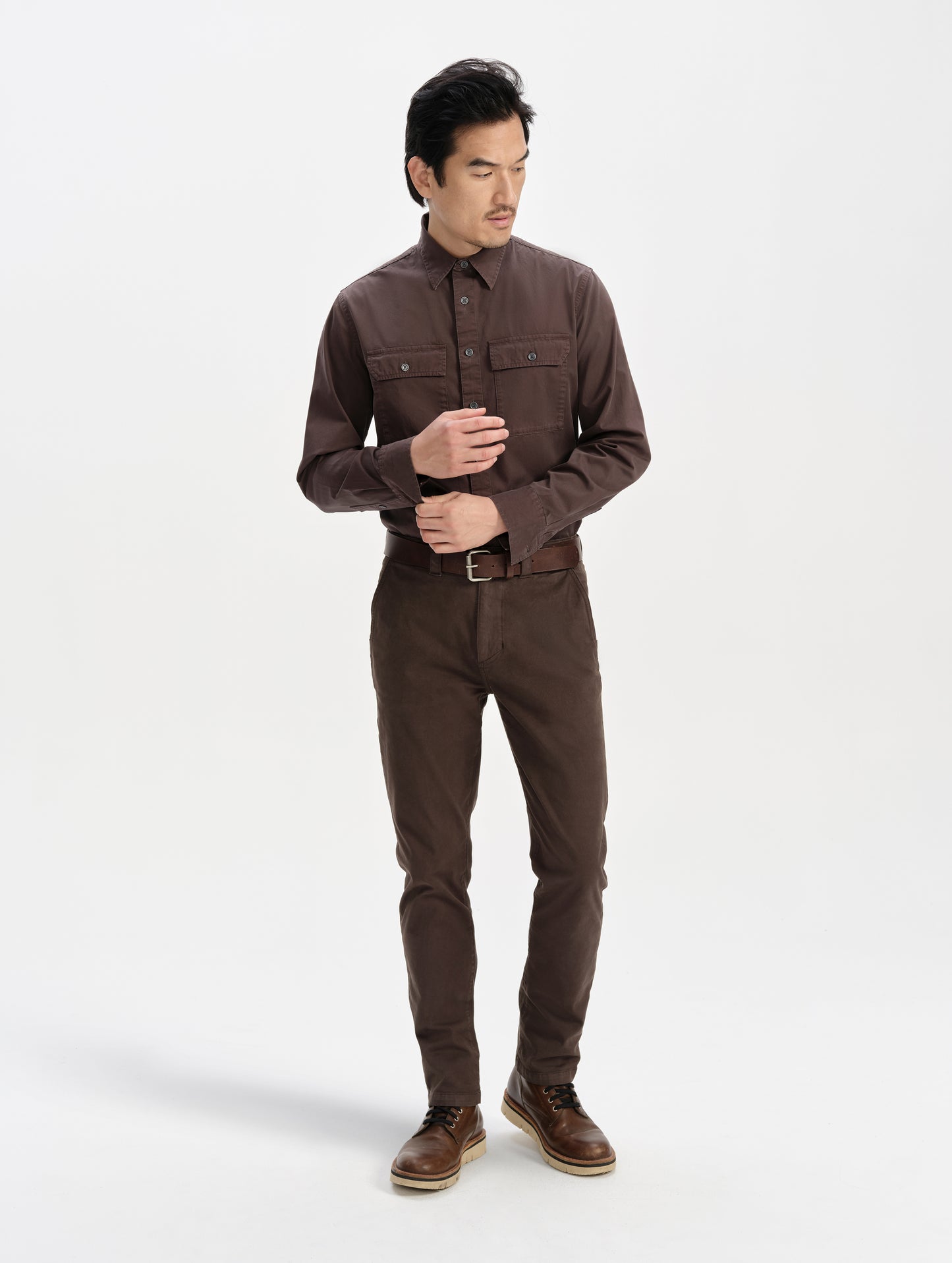 Front full-body view of man wearing the Flint Chino Pant in Ash Brown from AETHER Apparel.