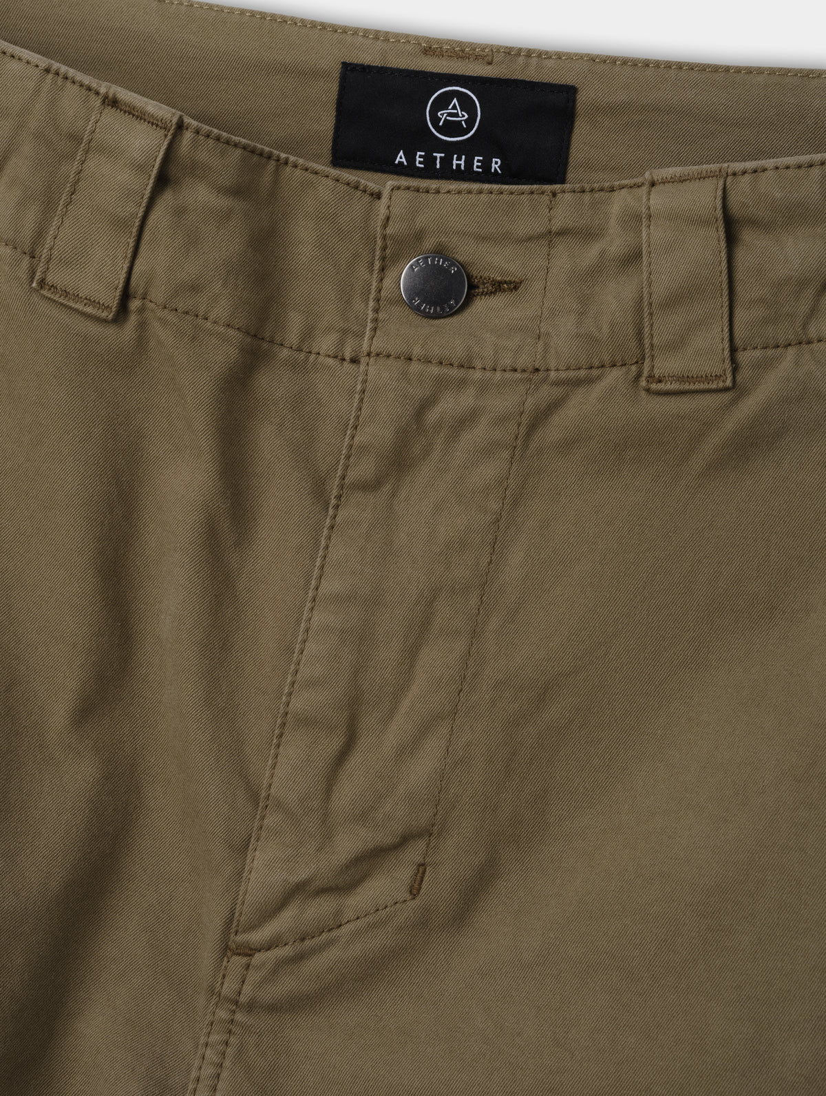 Closeup detailed view of the zippered fly and metal shank button closure on the Flint Chino Pant in Cadet from AETHER Apparel.