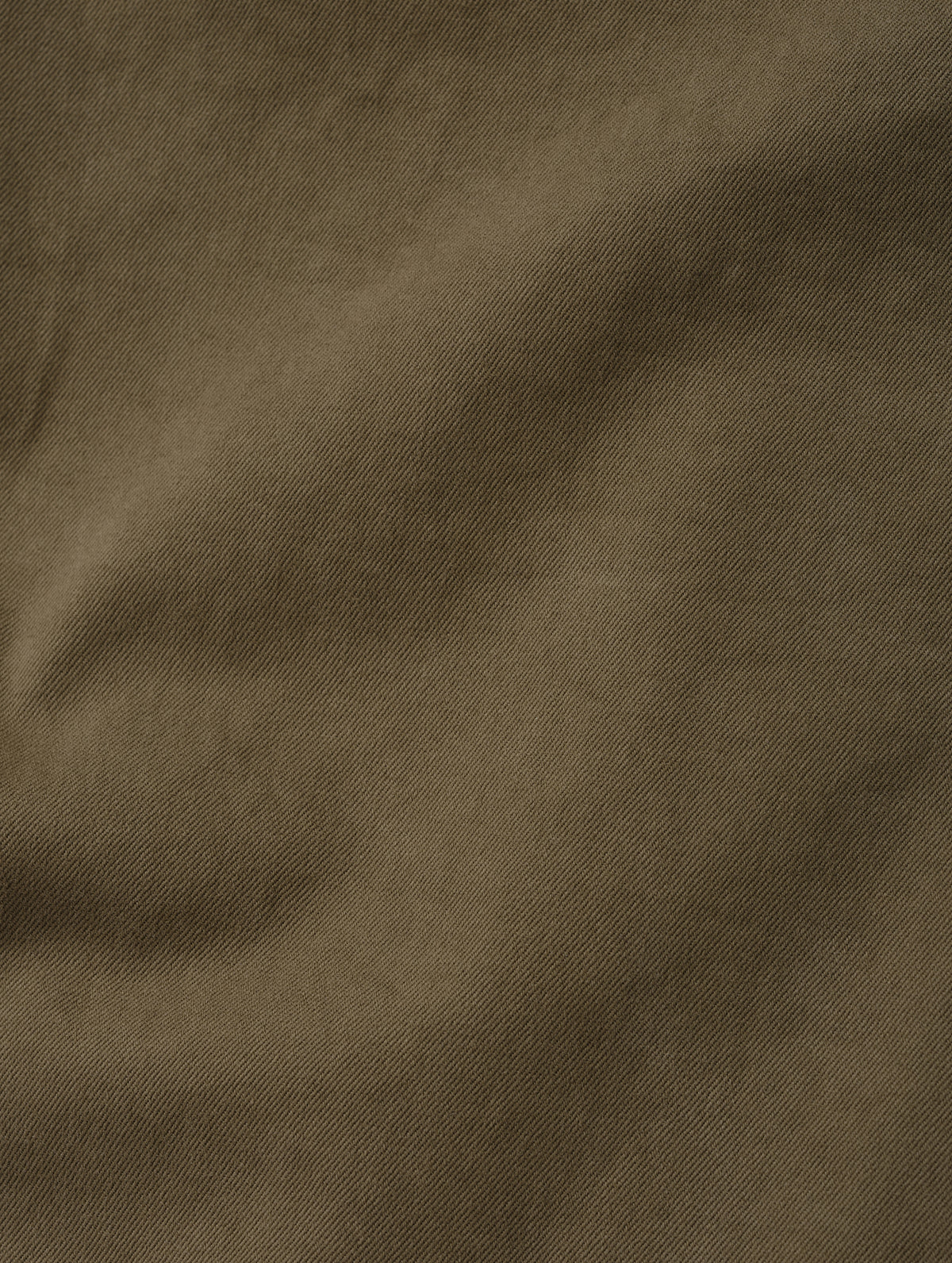 Closeup detailed view of the brushed fine twill construction on the Flint Chino Pant in Cadet from AETHER Apparel.