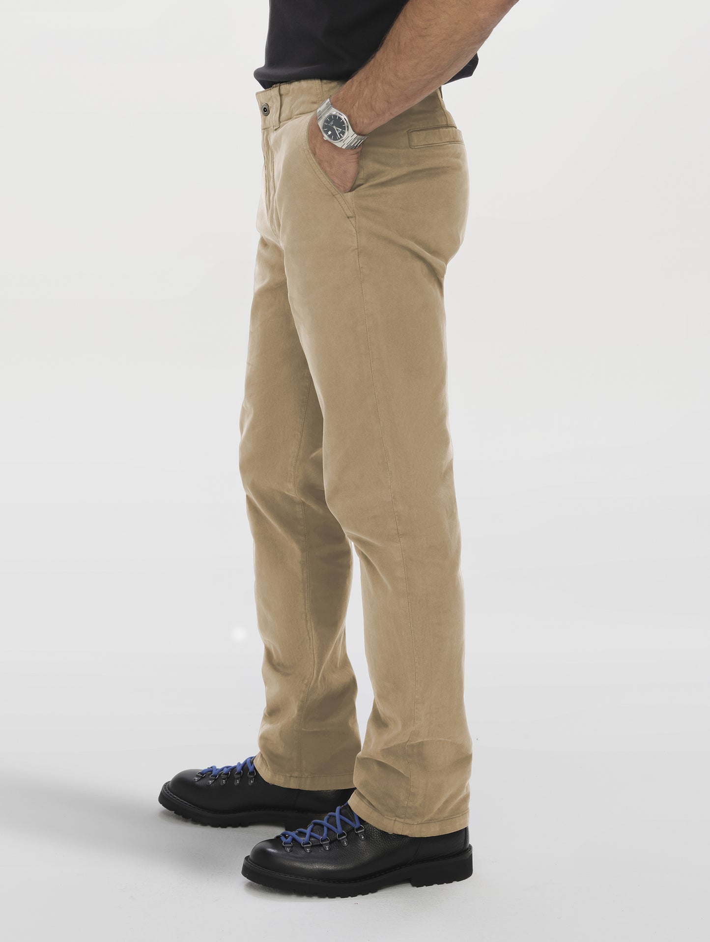 Side profile lower-body view of man wearing the Flint Chino Pant in Desert Tan from AETHER Apparel.