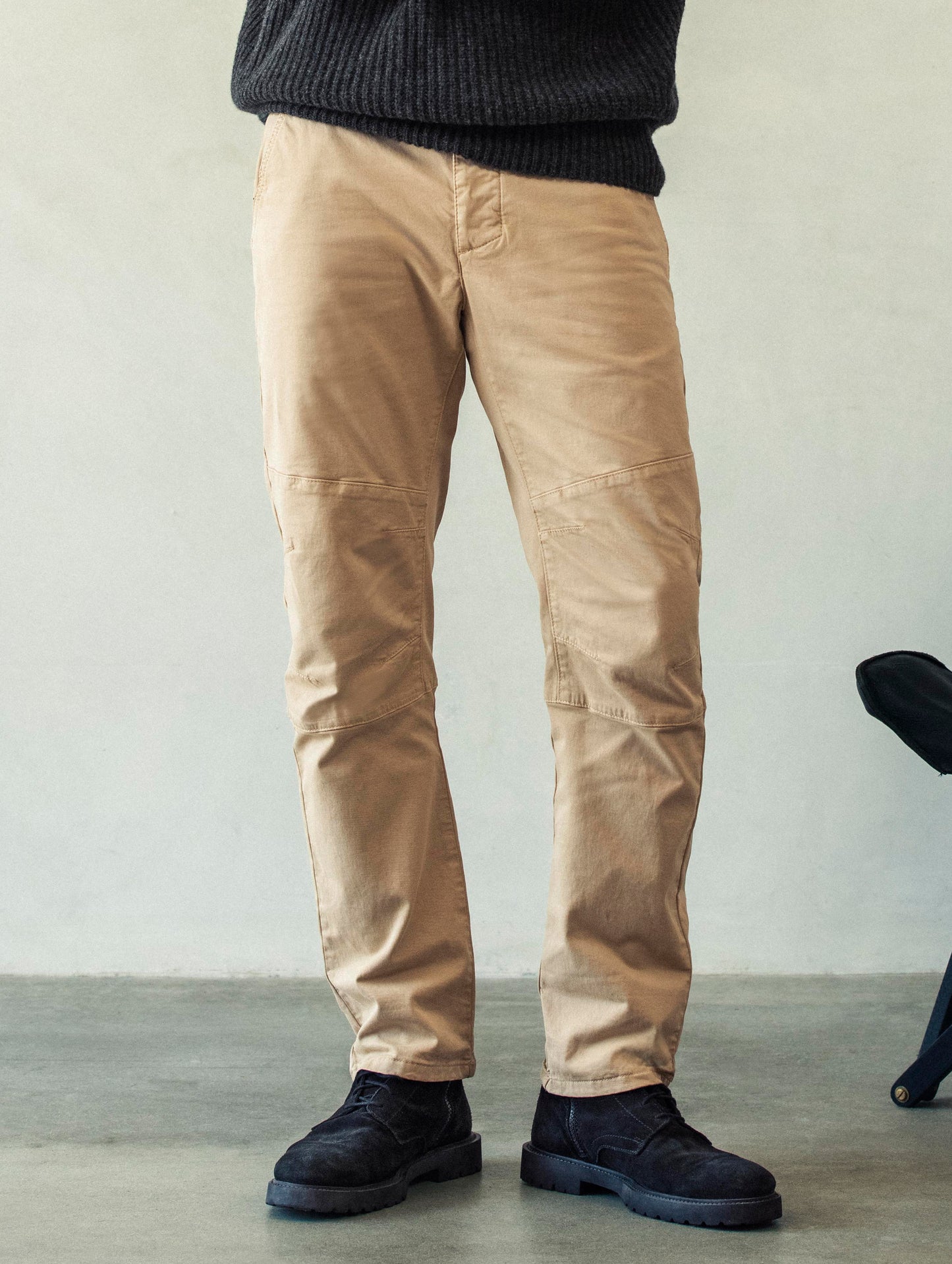 Front lower body view of man wearing Gabriel Articulated Chino Stretch pant in Desert Tan from AETHER Apparel.