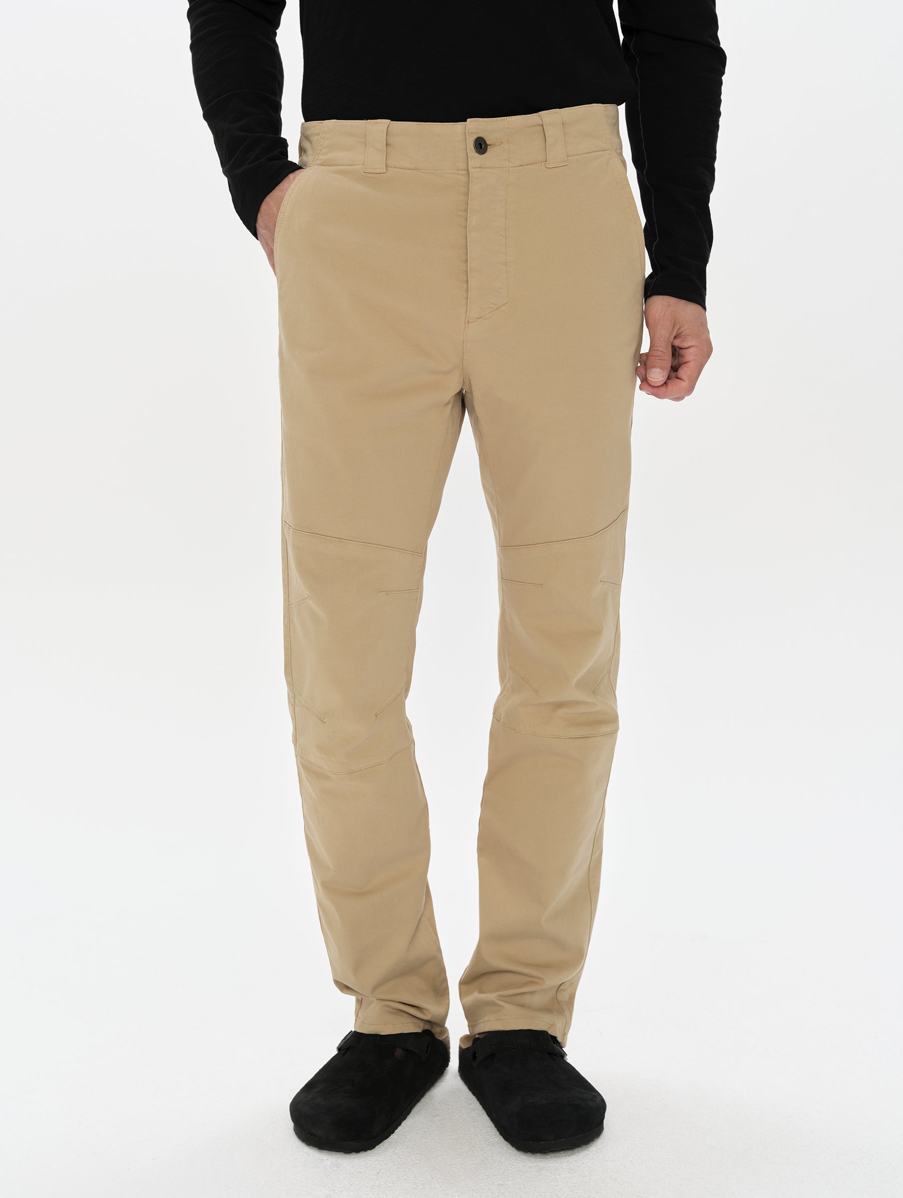 Front, lower-body view of man wearing the Gabriel Articulated Chino in Desert Tan from AETHER Apparel.