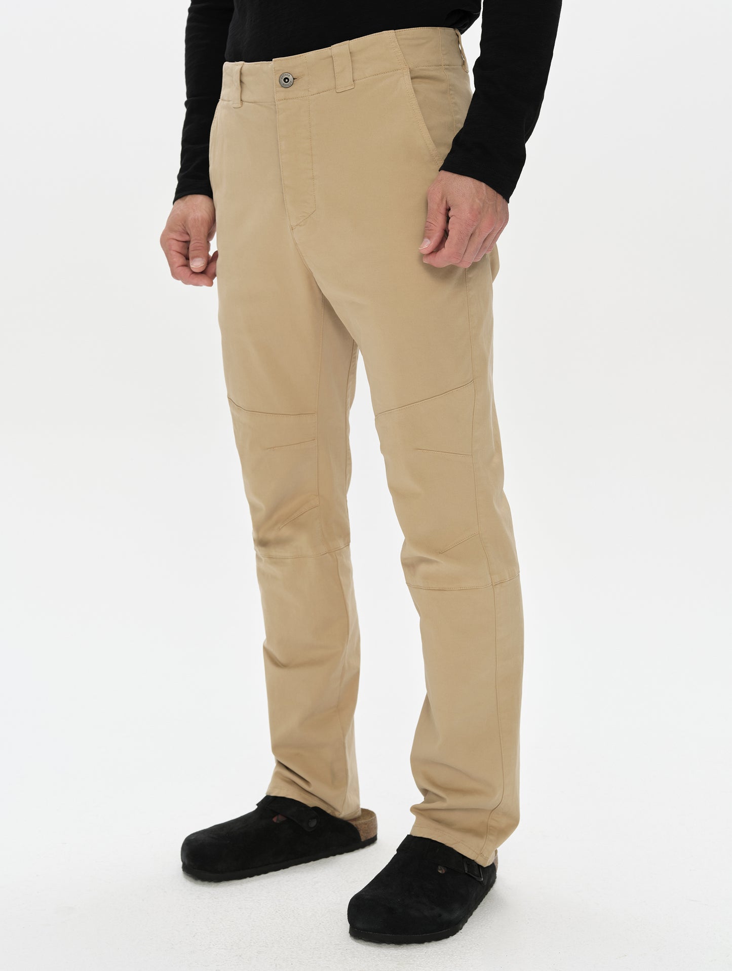 Front, 3/4, lower-body view of man wearing the Gabriel Articulated Chino in Desert Tan from AETHER Apparel.
