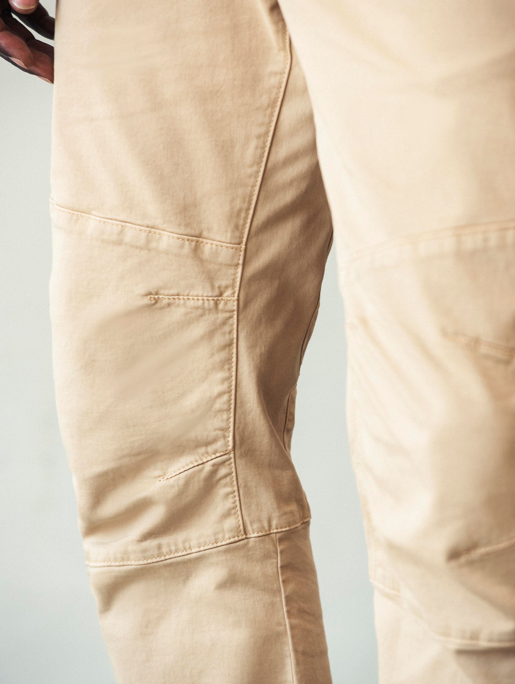 Closeup detailed view of the articulated knee panels on the Gabriel Articulated Chino Stretch pant in Tarmac Black from AETHER Apparel.