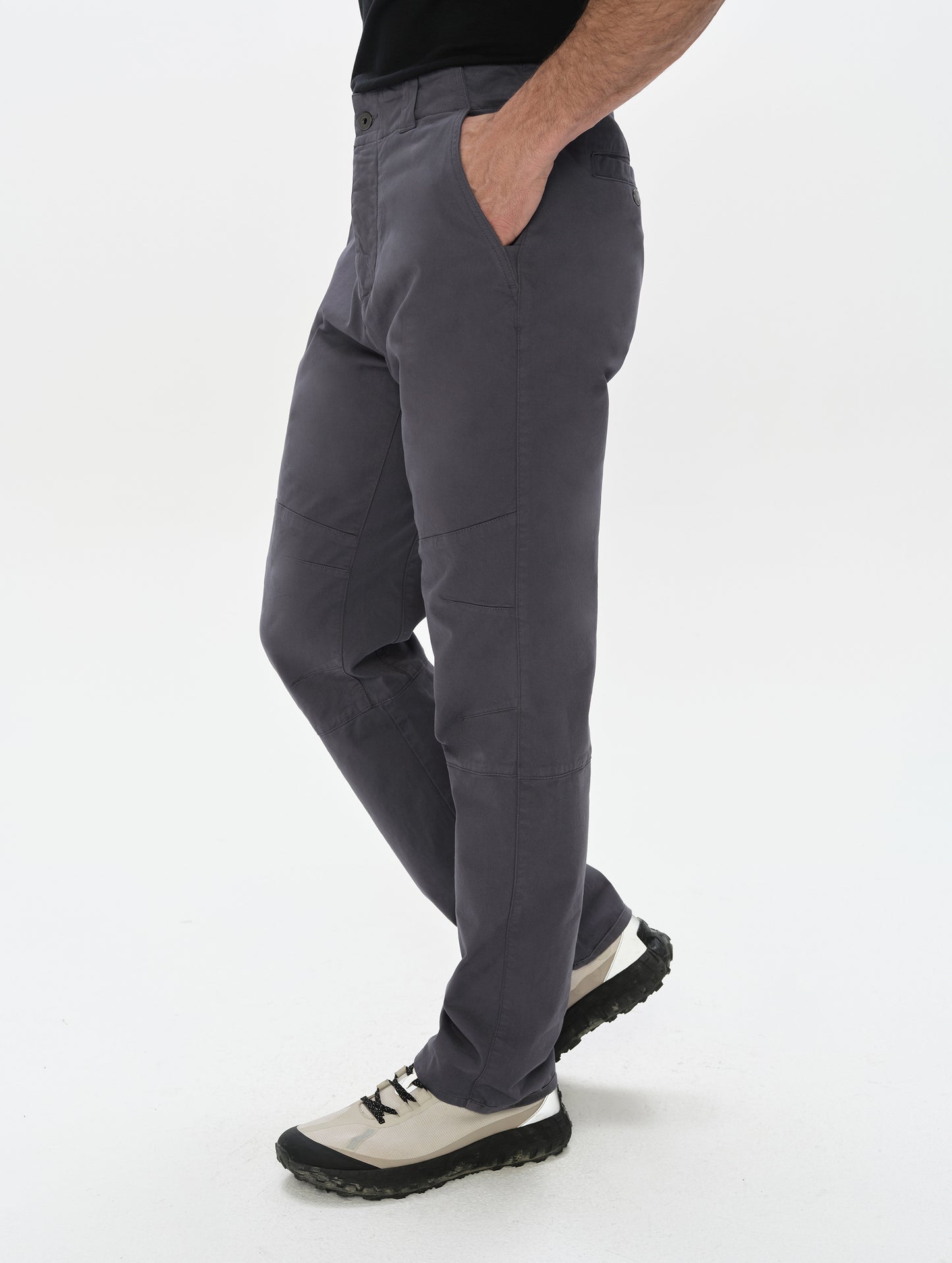 Side profile, lower-body view of man wearing the Gabriel Articulated Chino in Graphite from AETHER Apparel.