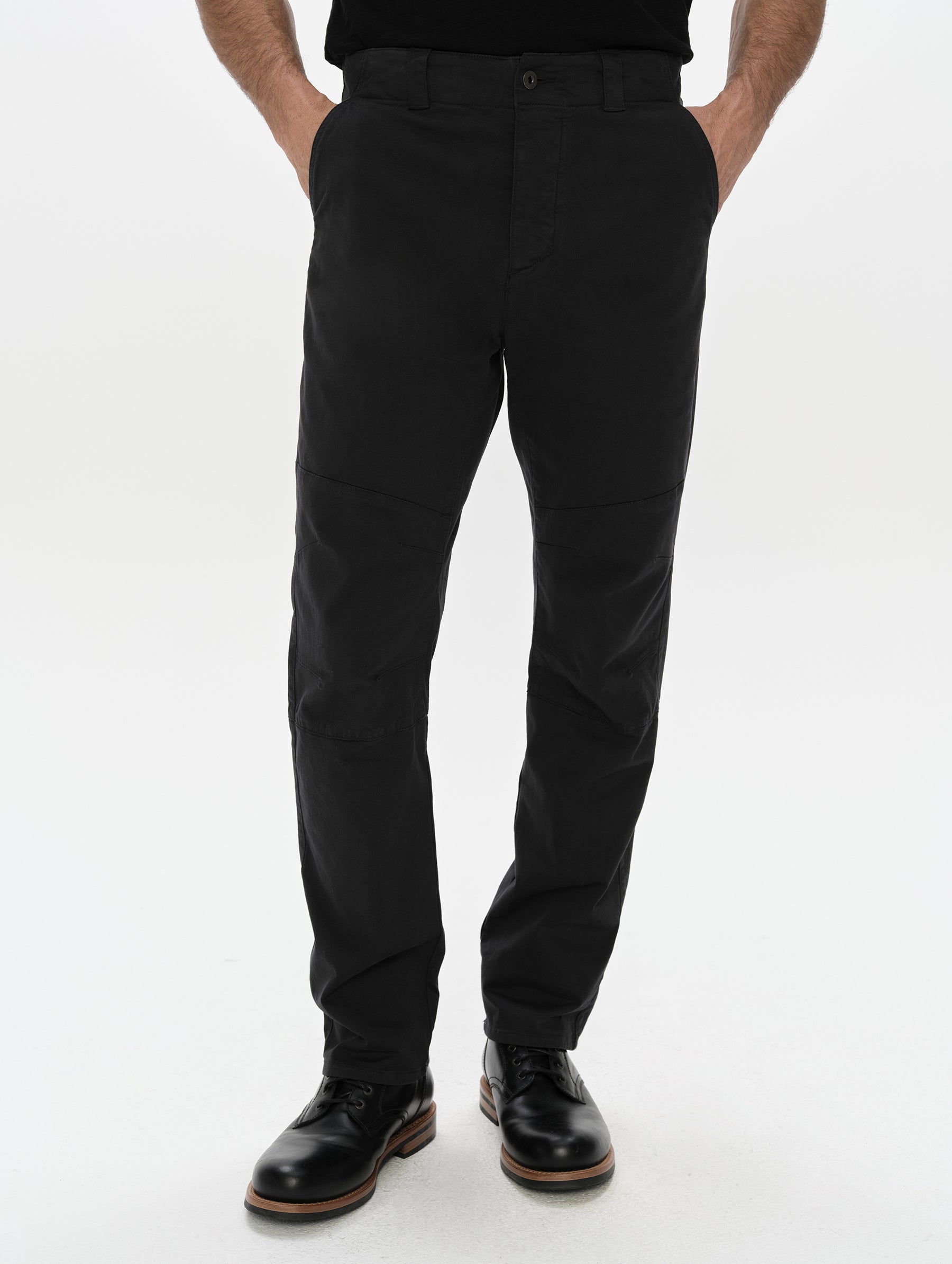 Front, lower-body view of man wearing the Gabriel Articulated Chino in Onyx Black from AETHER Apparel.