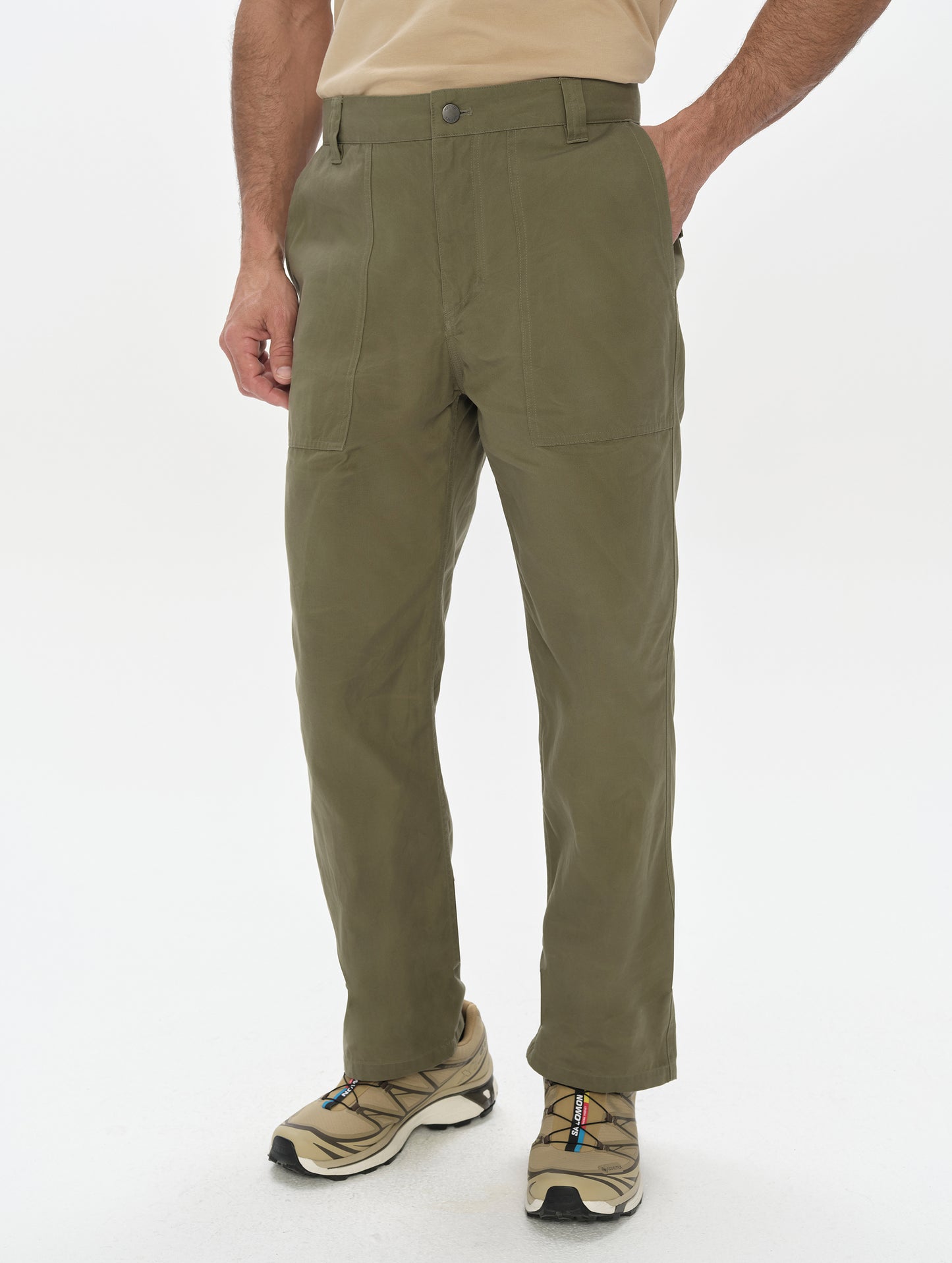 Front, lower-body view of man wearing the Gage Cotton Pant in Fern Green from AETHER Apparel.