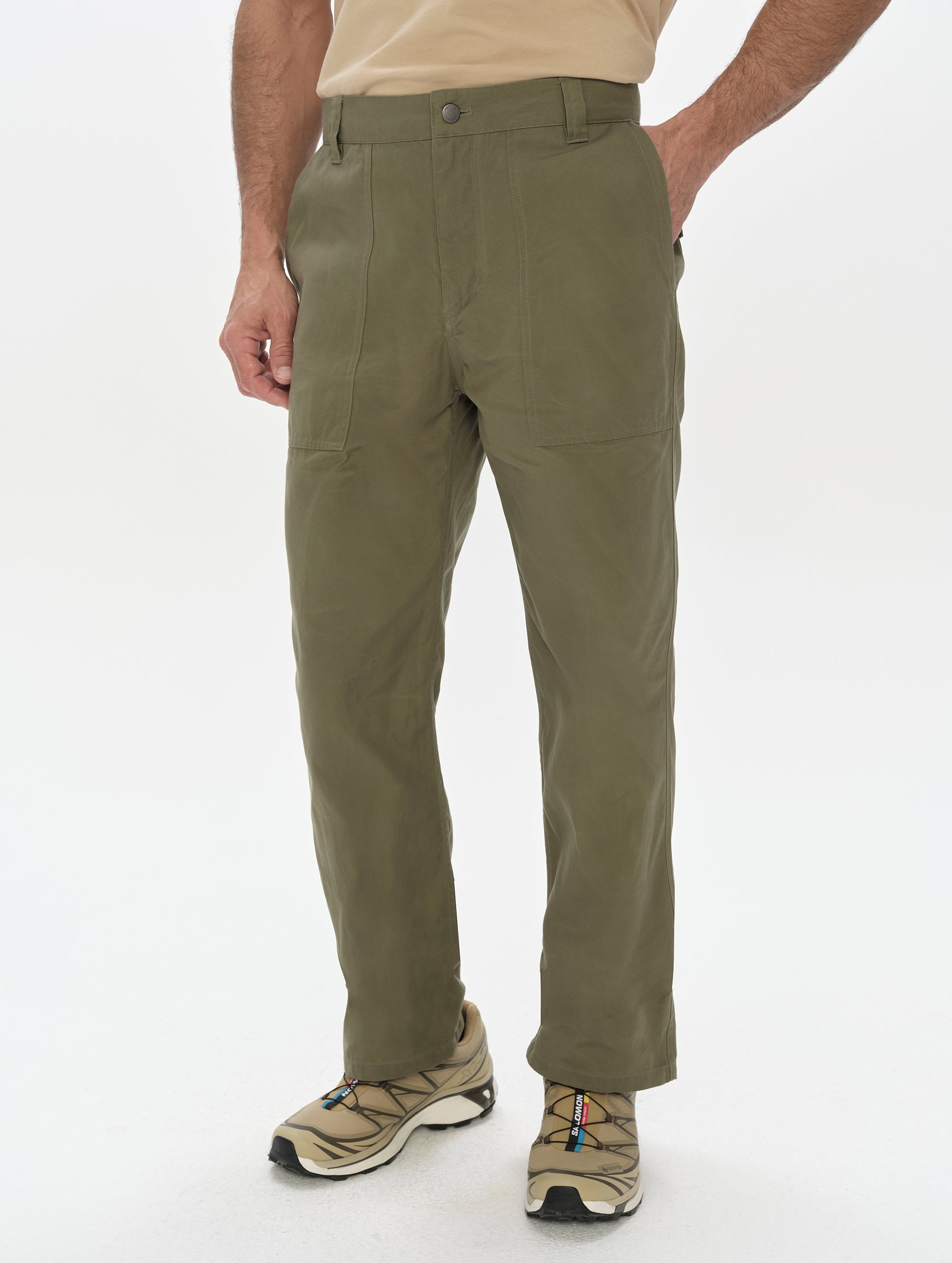 Front, lower-body view of man wearing the Gage Cotton Pant in Fern Green from AETHER Apparel.