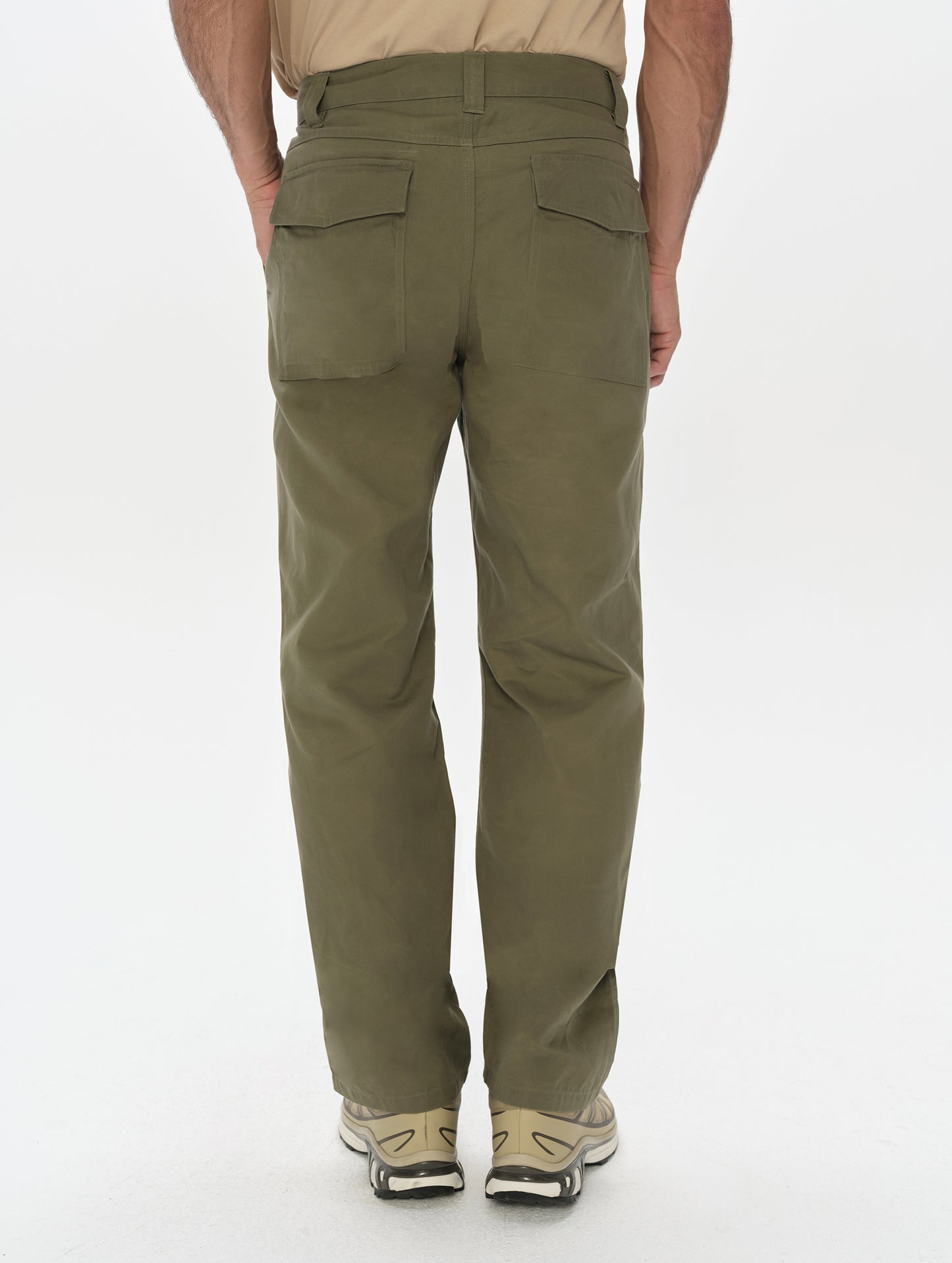 Rear, lower-body view of man wearing the Gage Cotton Pant in Fern Green from AETHER Apparel.